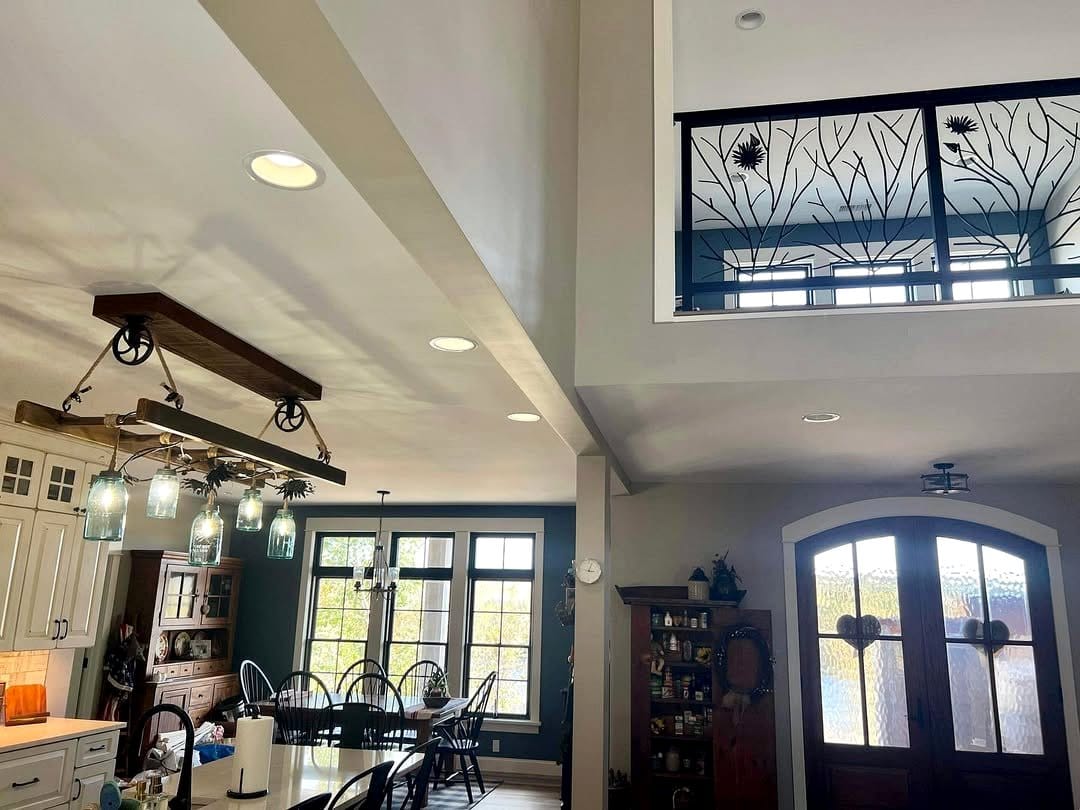 Mason jar chandelier over rustic dining table