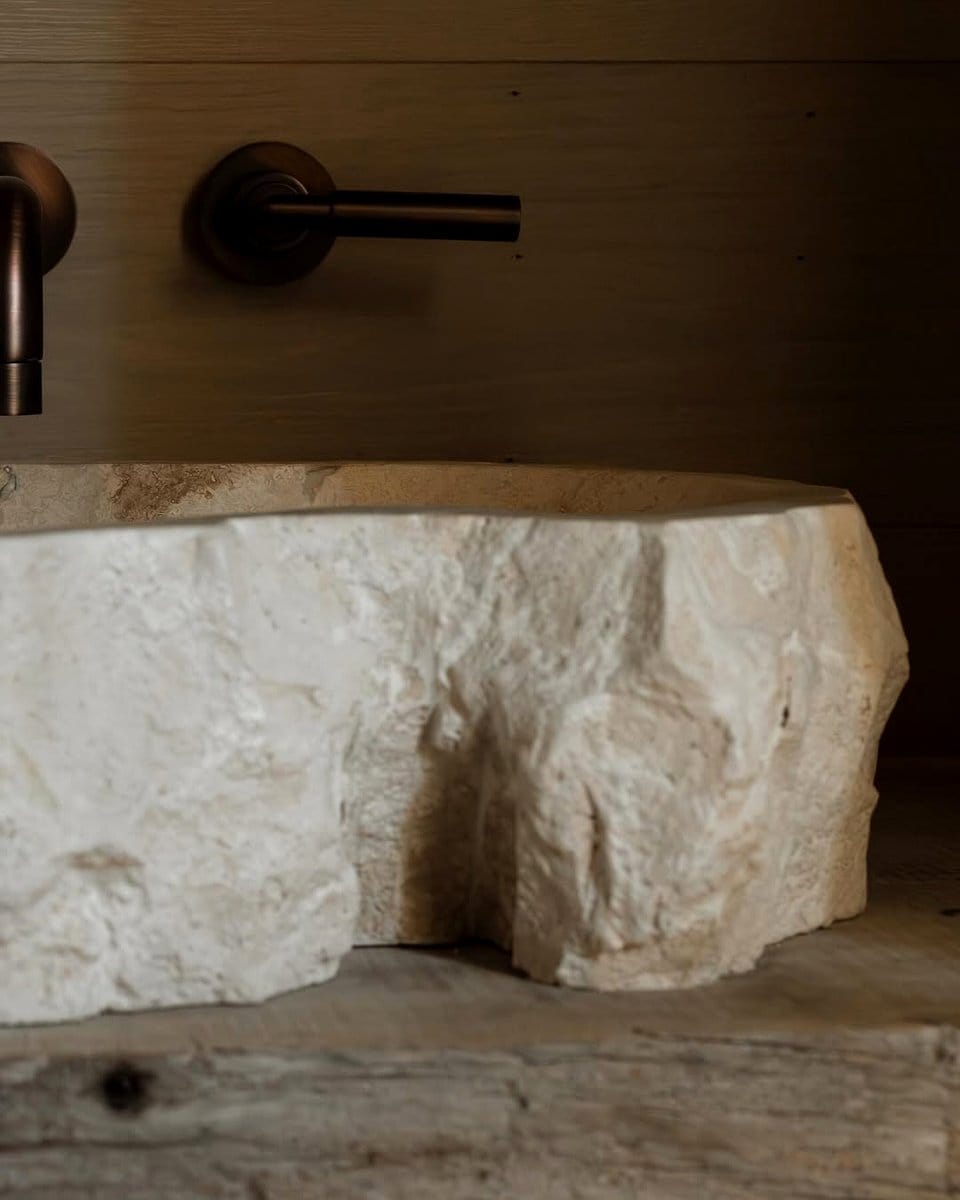 Wooden bathroom vanity with stone sink