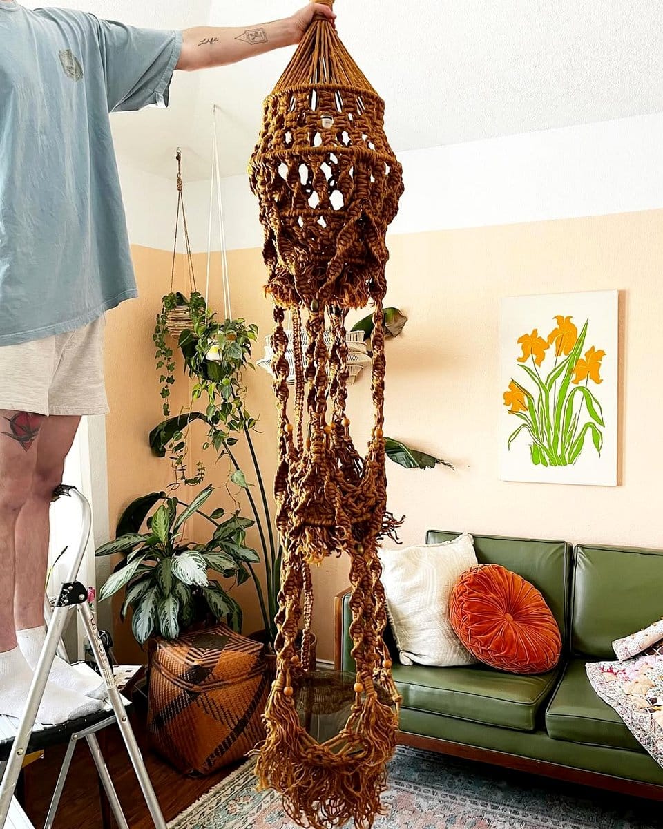 macramé hanging planters above bench