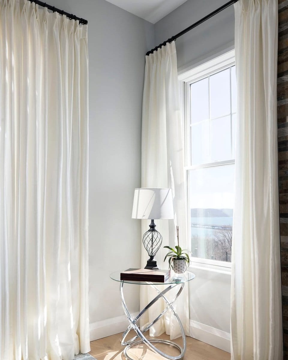 Clean minimalist window treatments with sheer curtains
