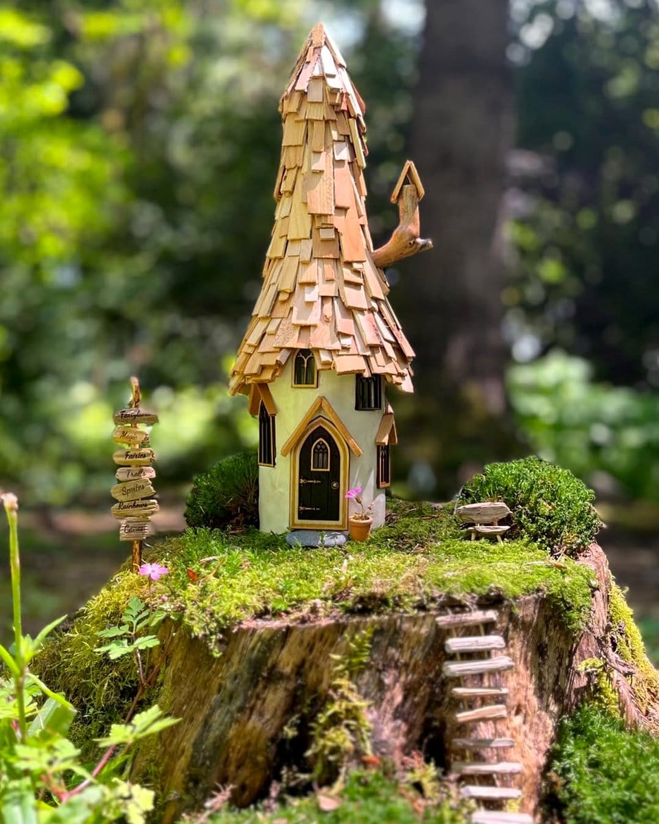 tiny fairy house in moss