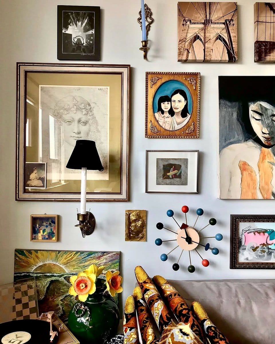 Eclectic gallery wall in hallway