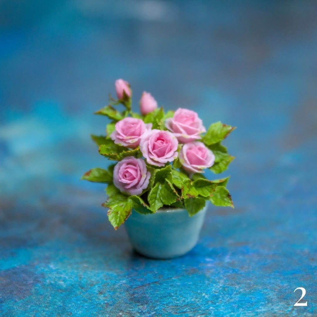 Miniature roses in elegant glass vase