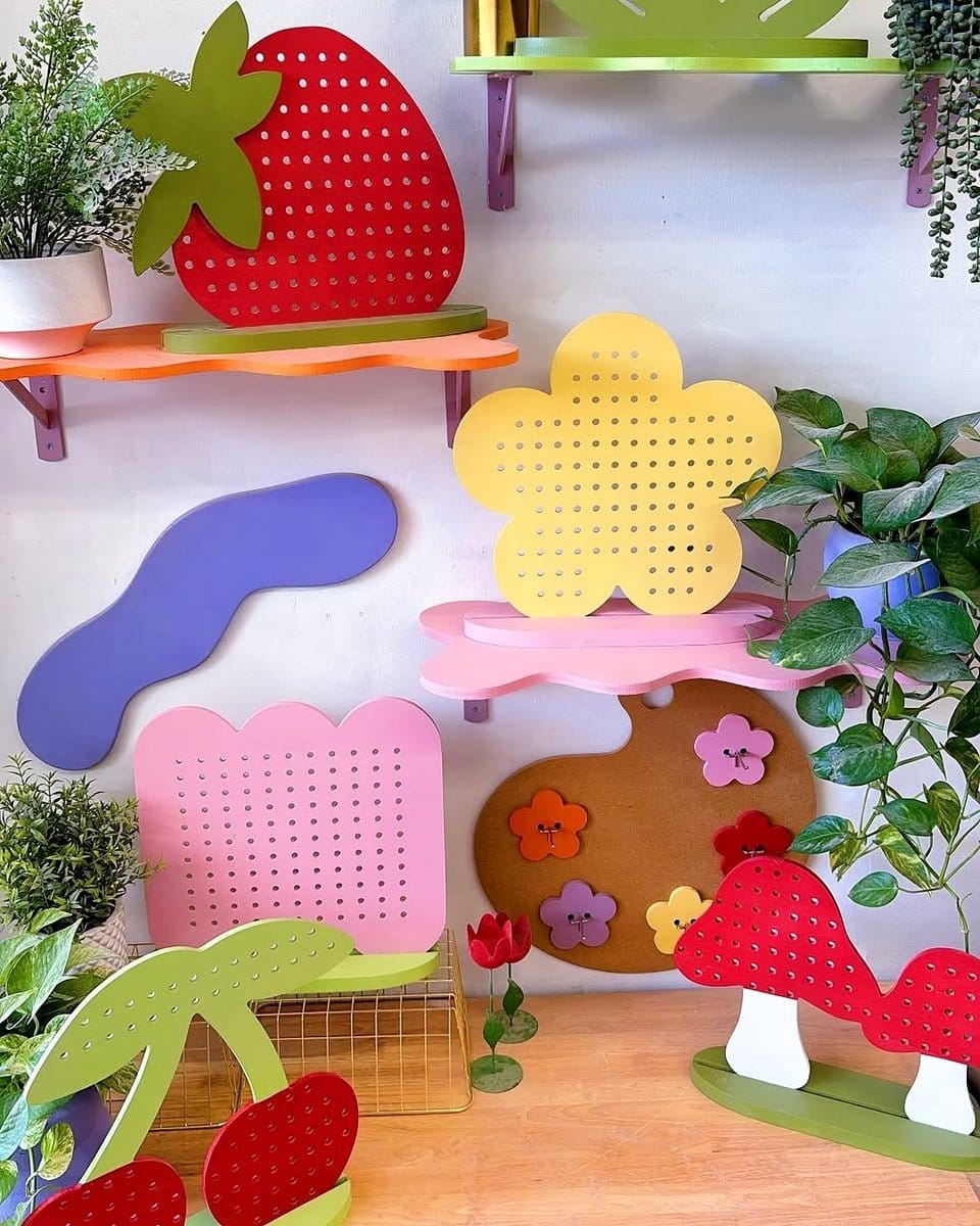 pegboard with hanging small pots