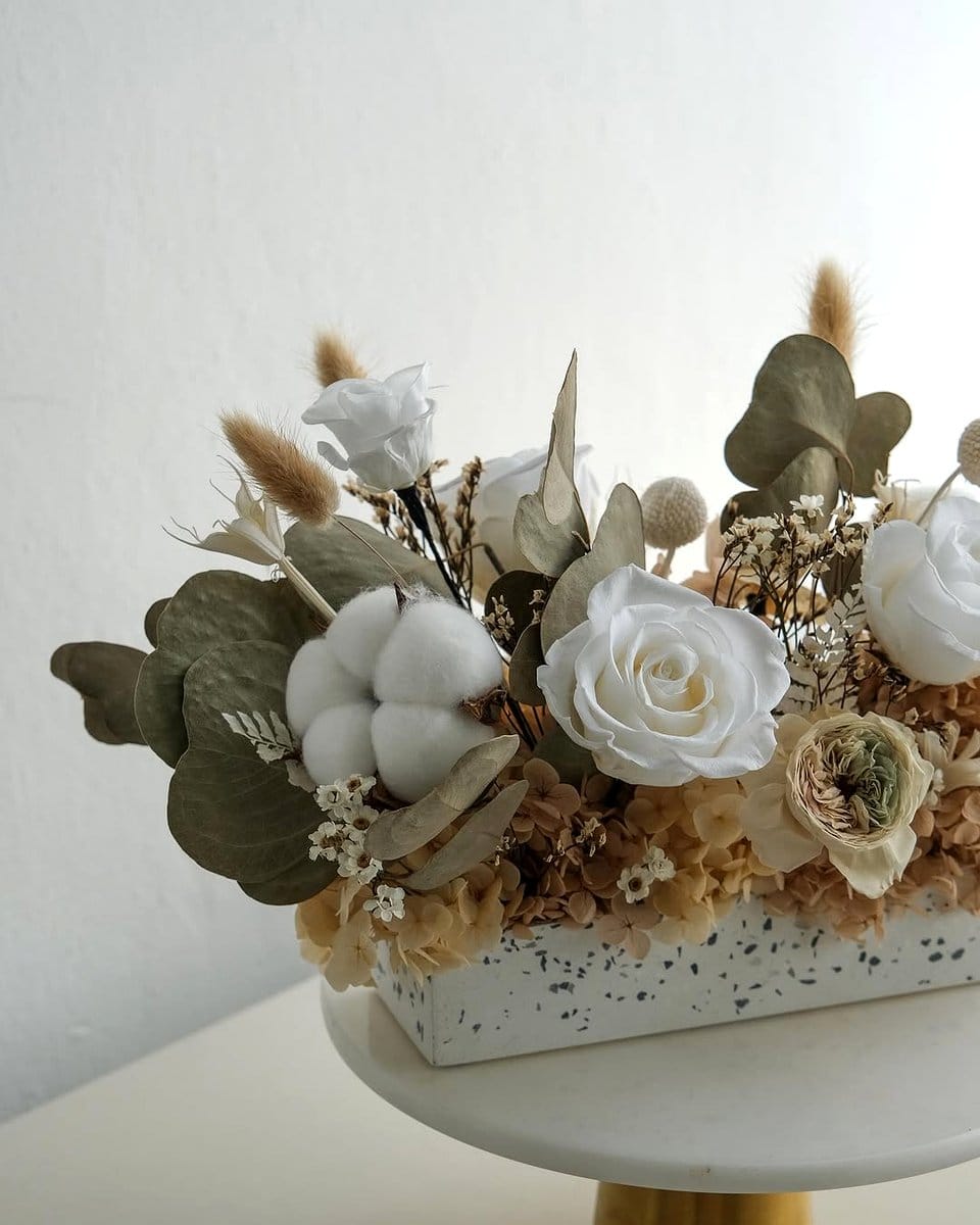 preserved plant centerpiece on dining table