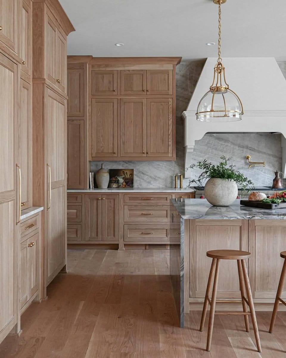 Vintage industrial pendant lights above rustic kitchen island
