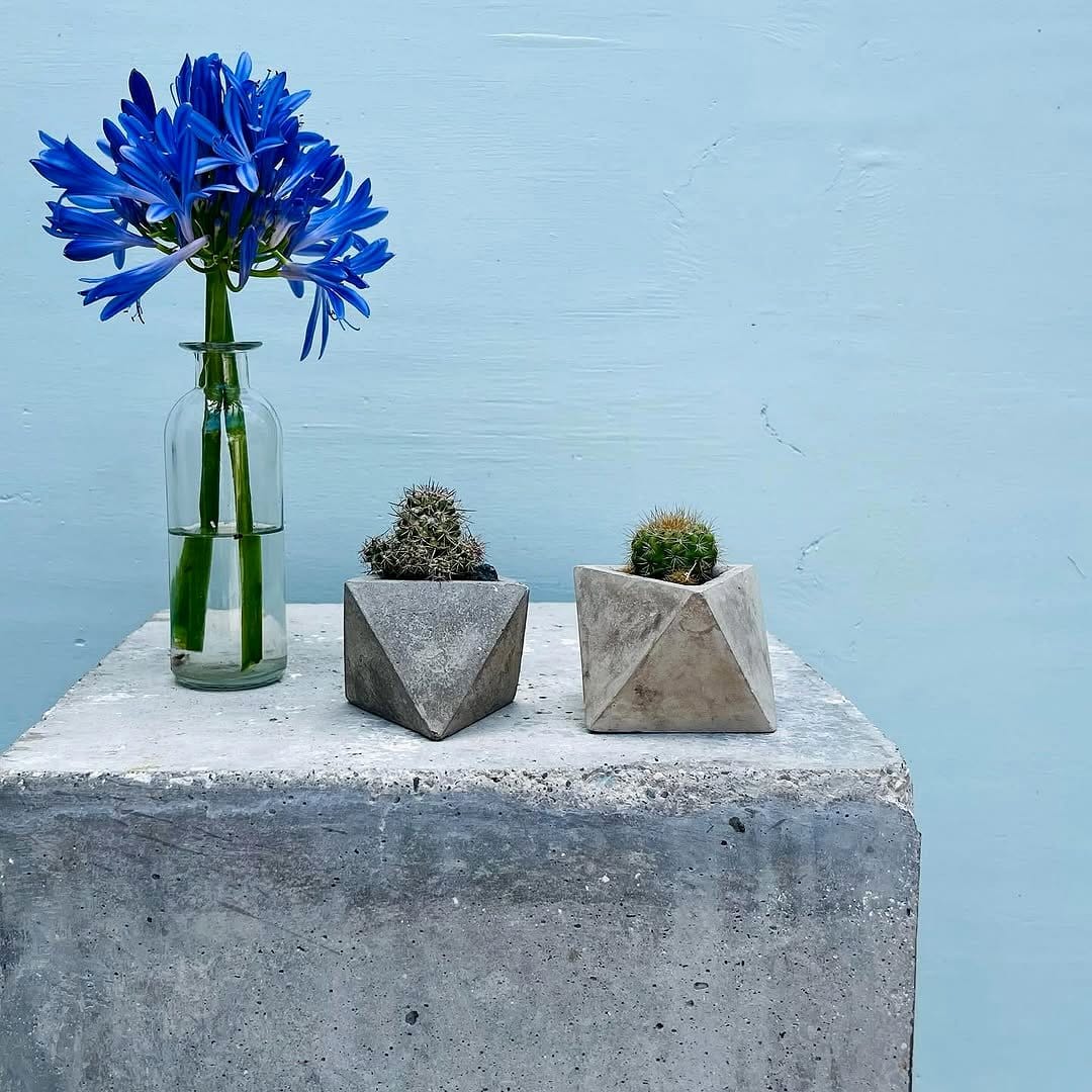 concrete and glass planter on desk