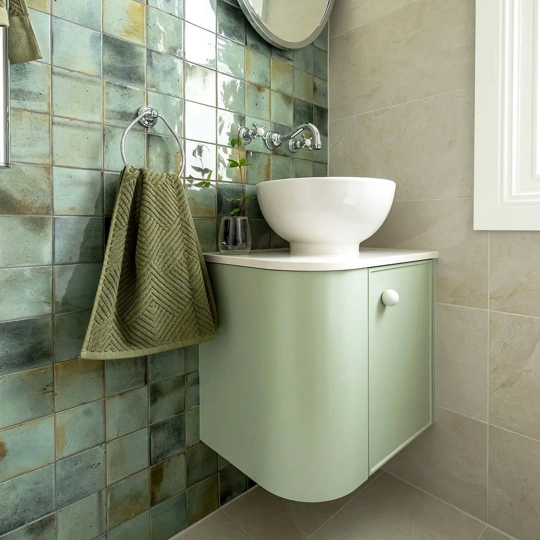 sage green towels on rustic towel rack