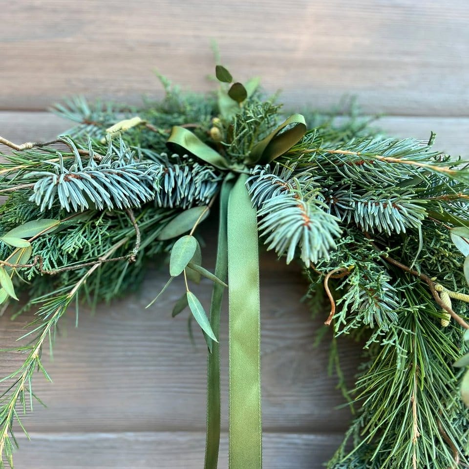 Minimalist greenery wreath on door