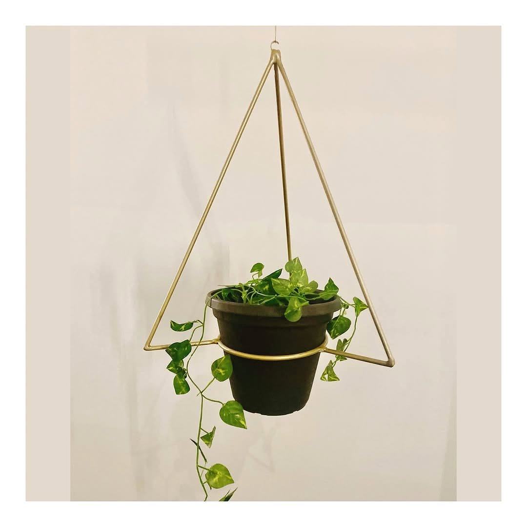 triangular metal plant stand with greenery