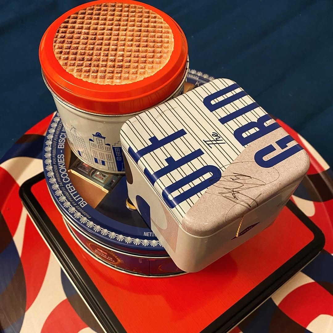 decorative biscuit tin with sewing supplies