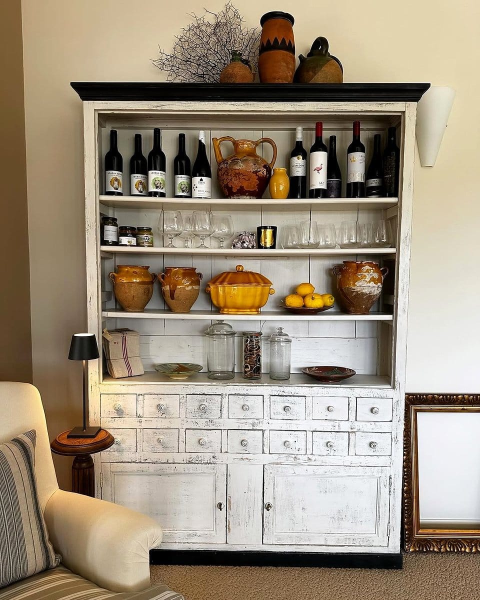 Rustic open kitchen shelving with vintage dishes