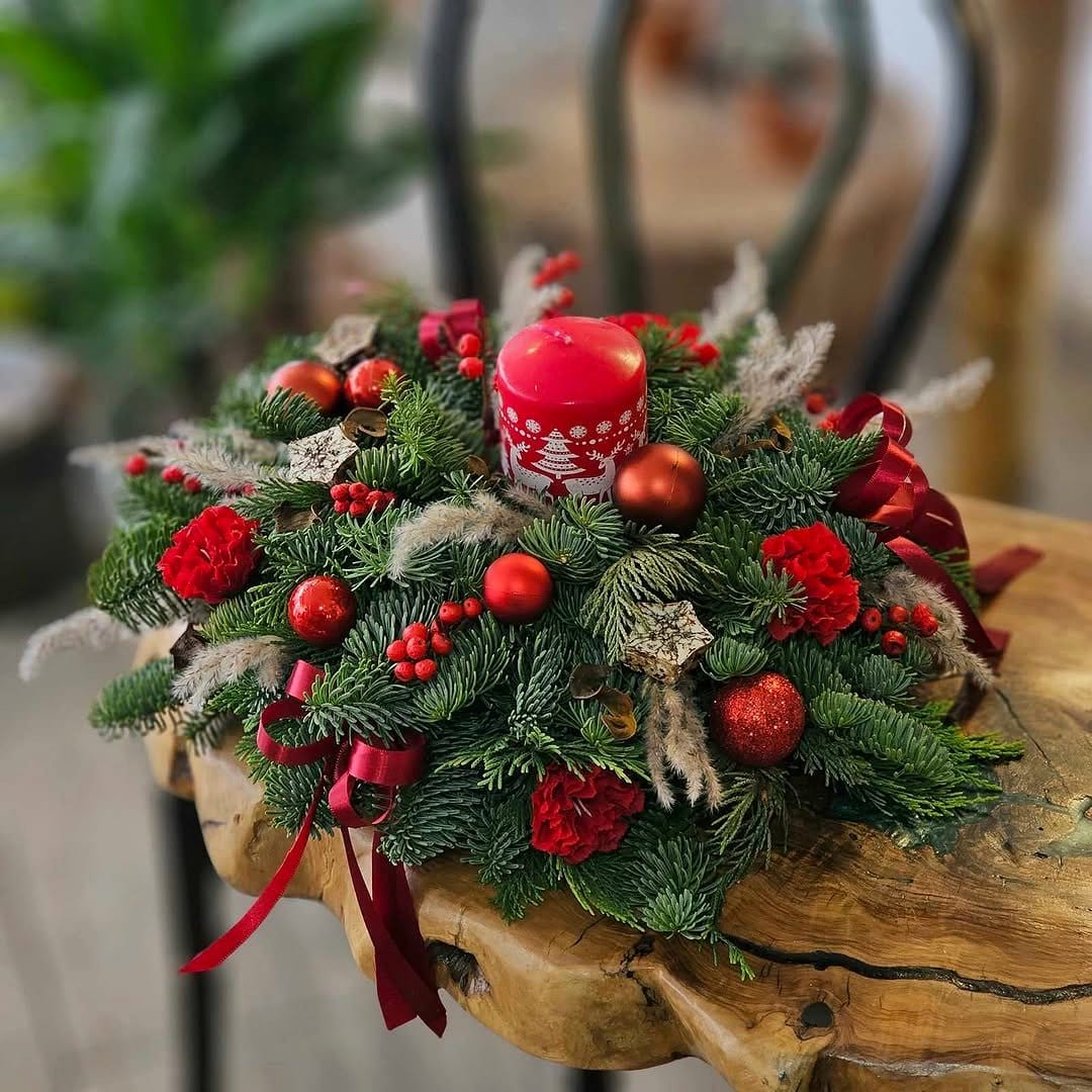 Clay pot centerpiece with candles and flowers
