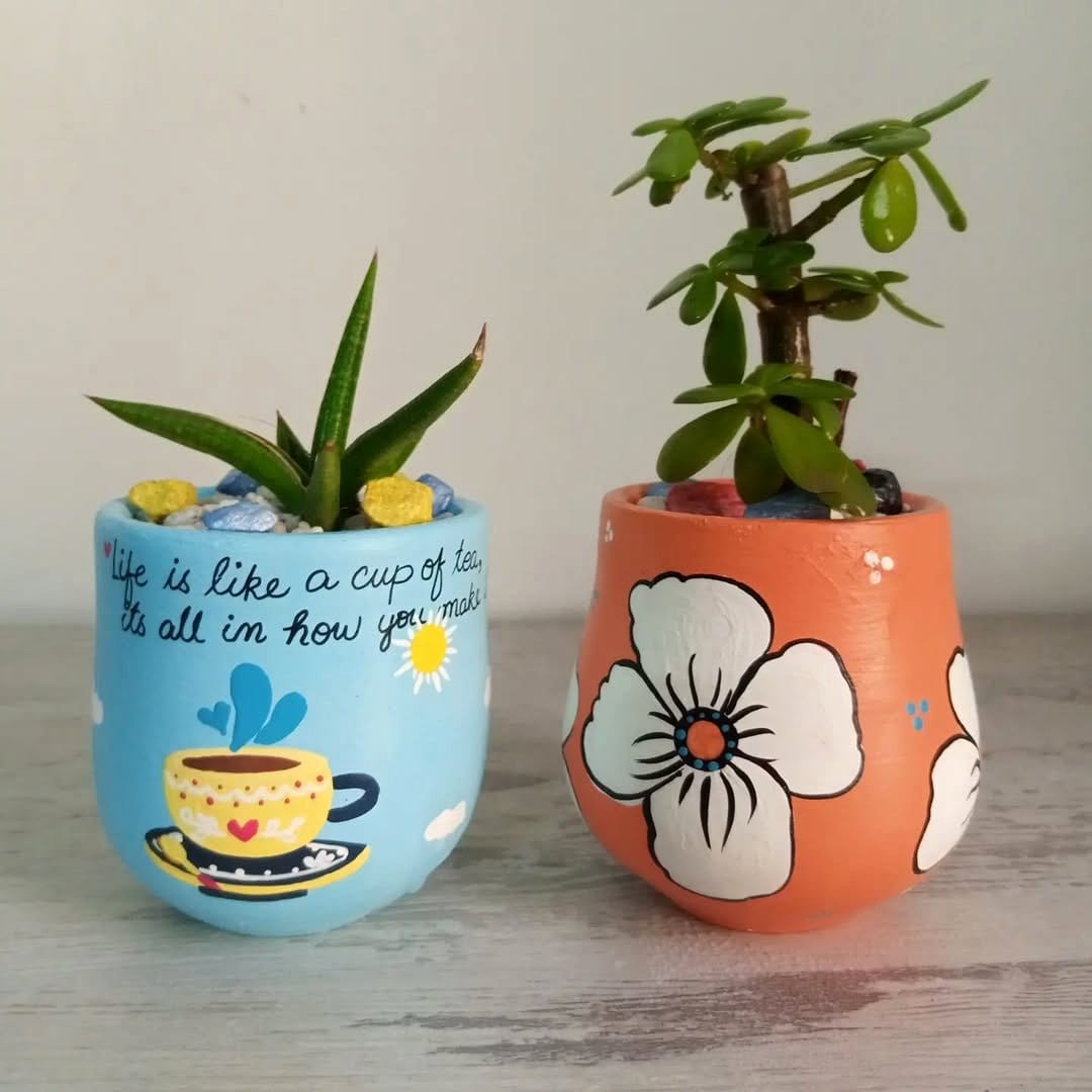 Black and white geometric planters with small cacti