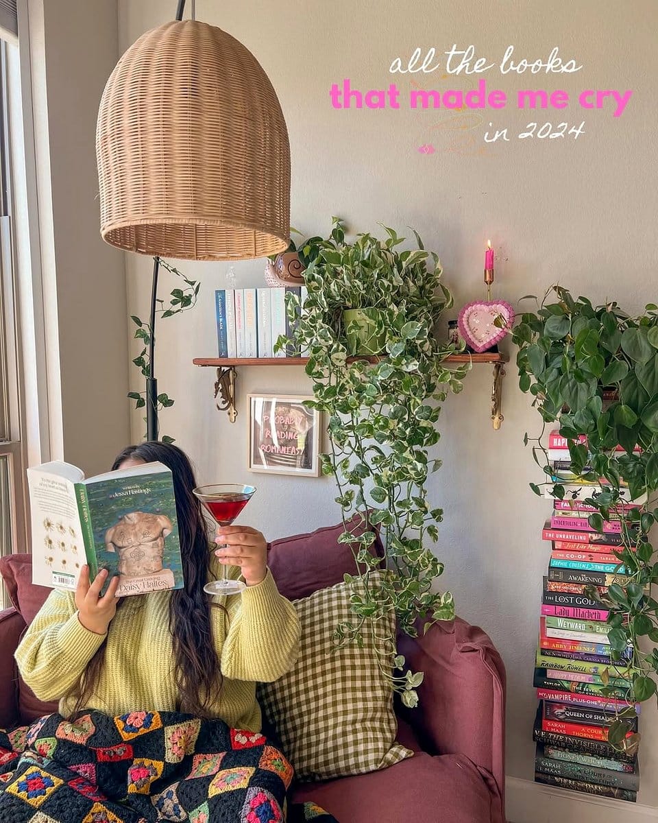 stacked books with cascading plants