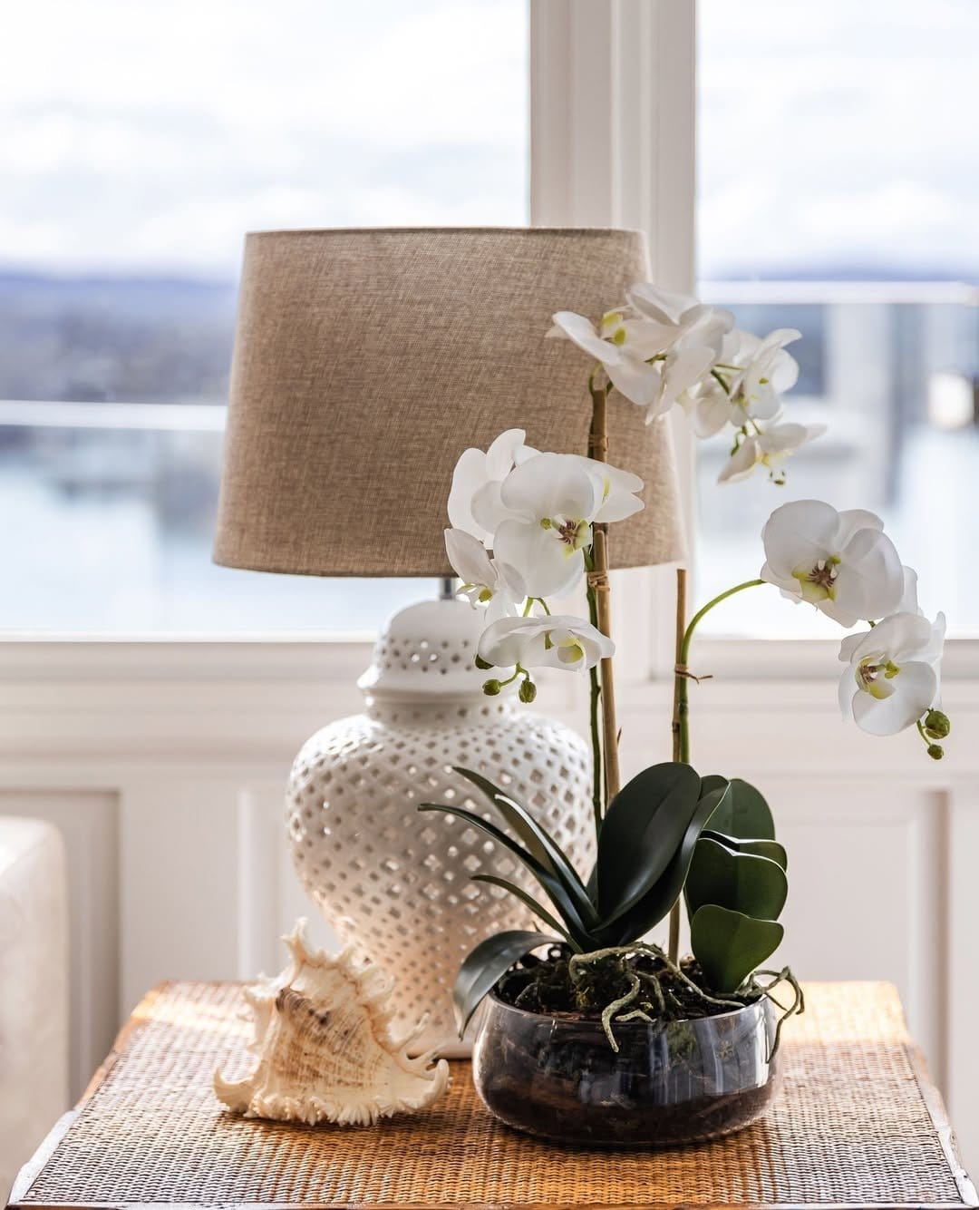 Elegant orchids on sleek glass table