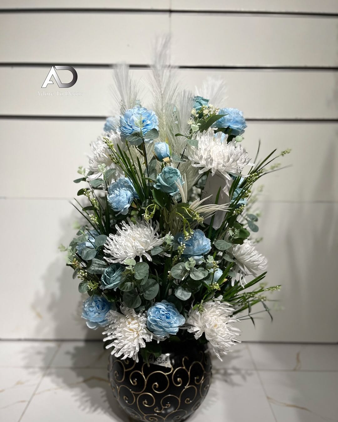 Elegant black vases with minimalist plant arrangements