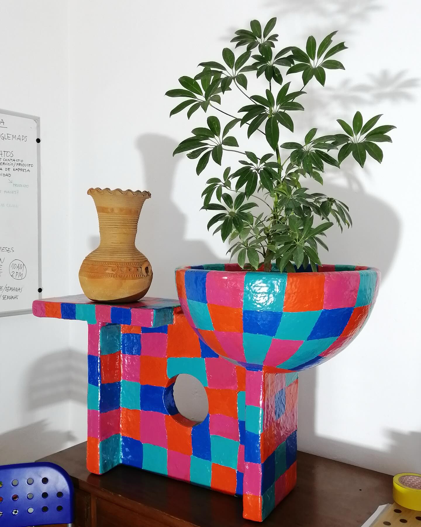 multi-tiered fiberglass planter with succulents