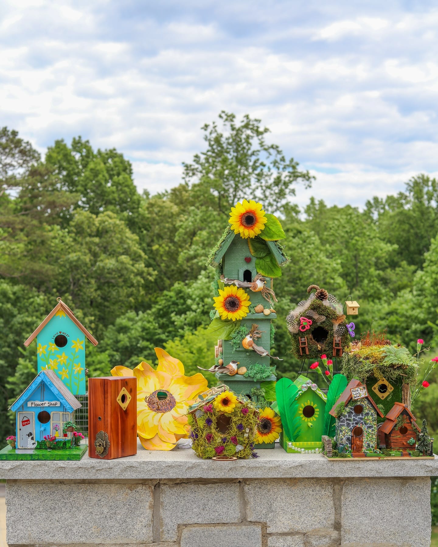 Whimsical birdhouse garden with wooden crates