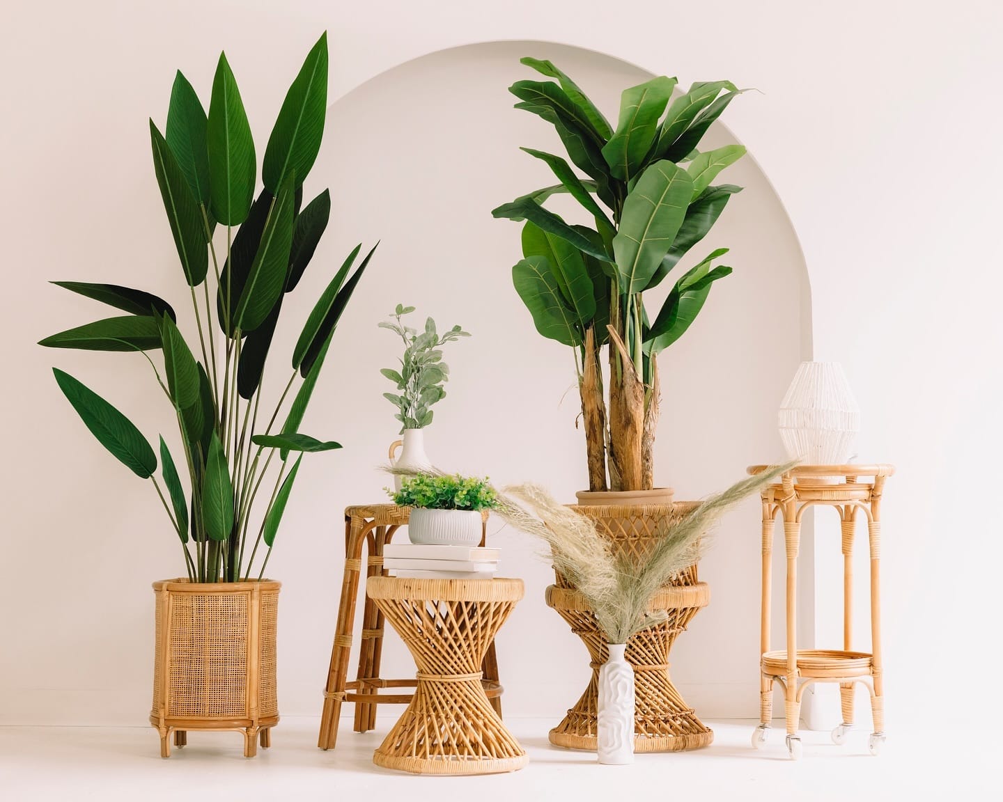 Rattan shelf with geometric planters and succulents