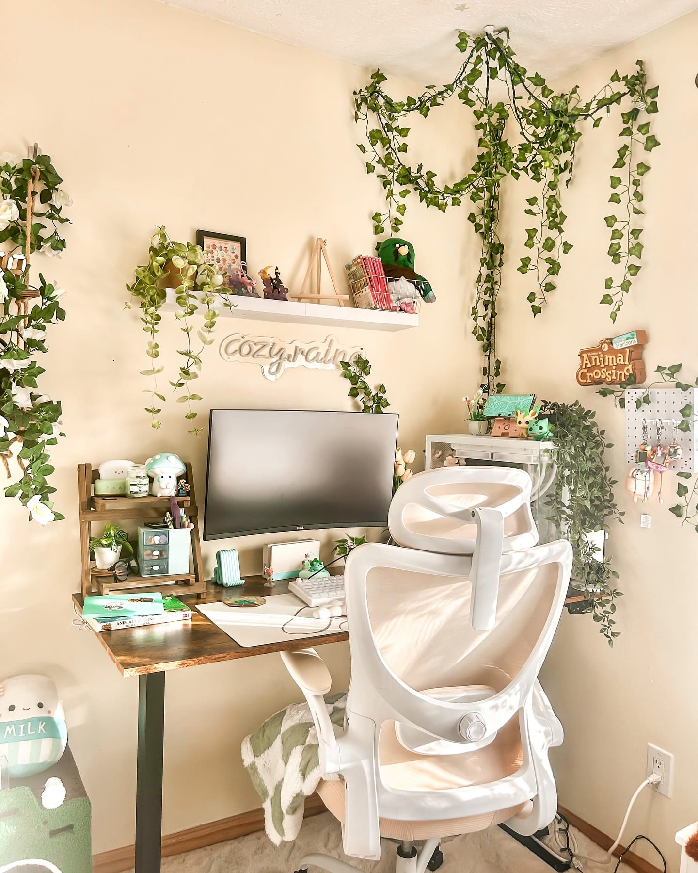 Desk with potted plants and laptop