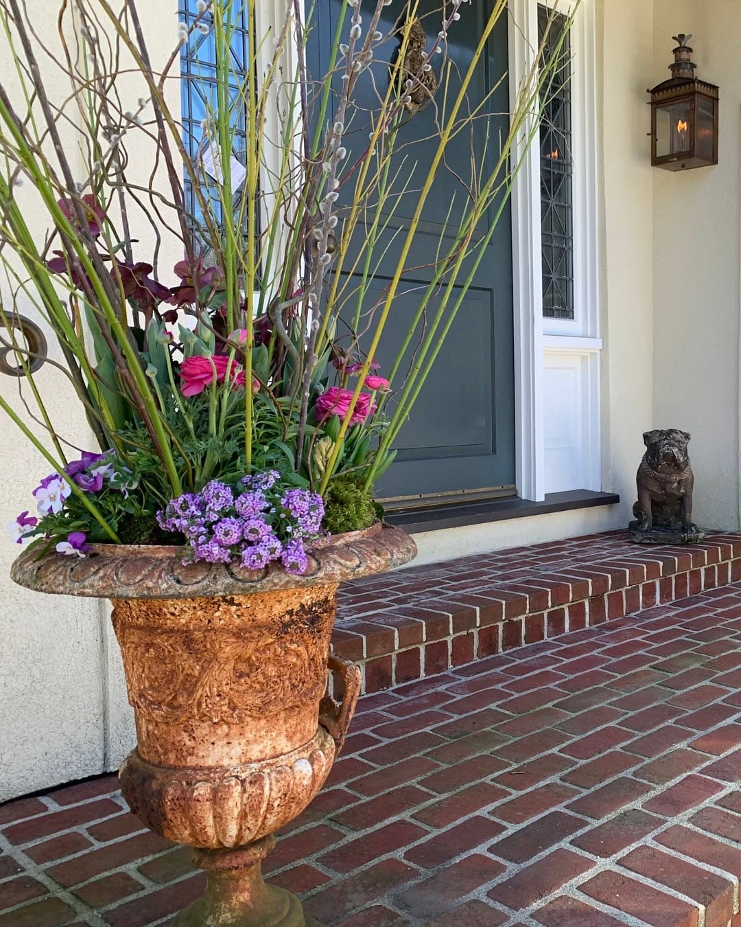 pair of cast iron urns flanking a doorway