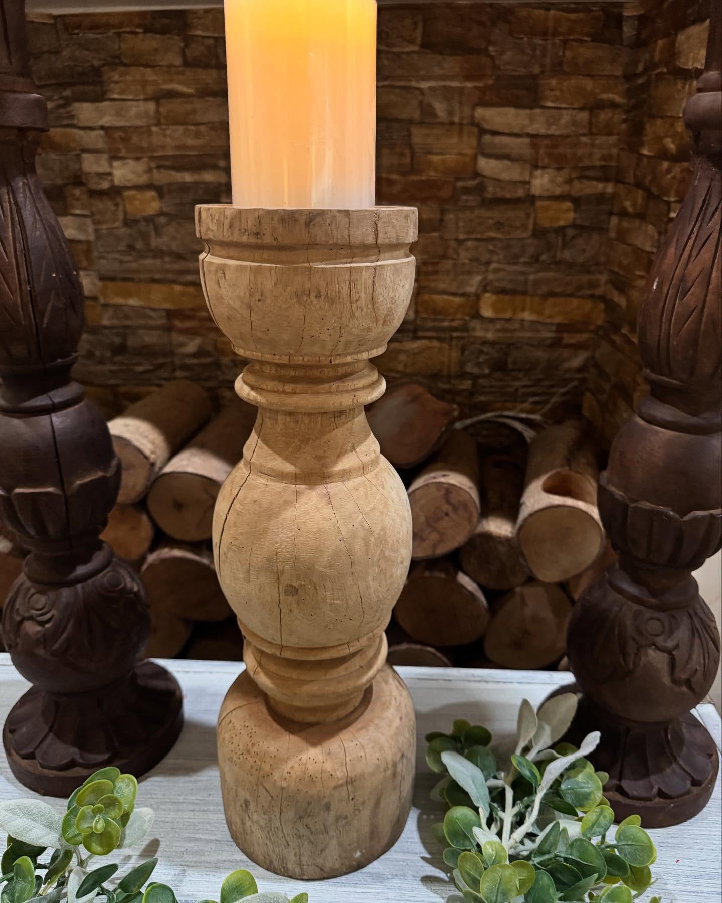 wooden candle holder with lit candles