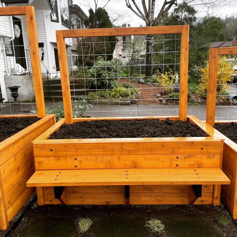 Long reclaimed wood trough with seasonal flowers