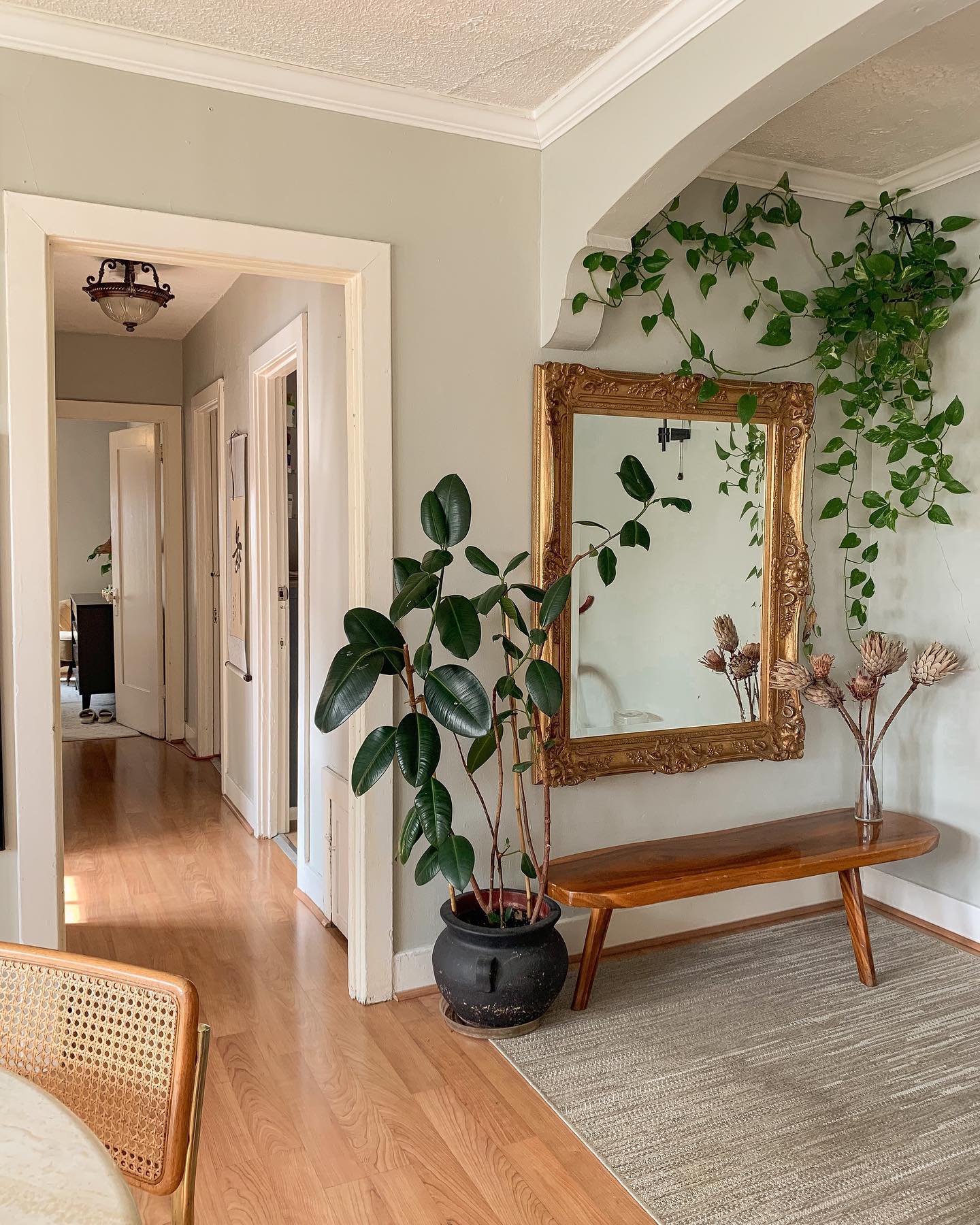 Entryway with clay pots and welcome mat