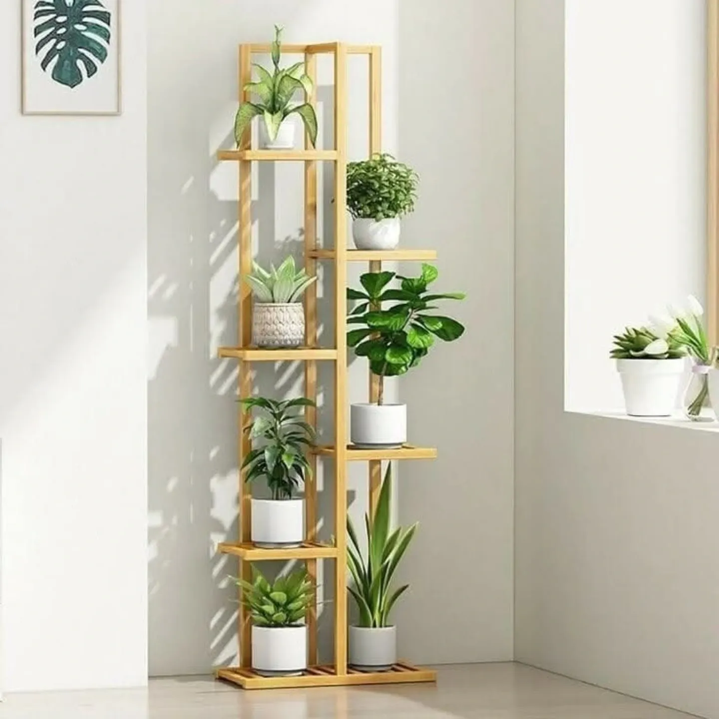 Vintage monochrome plant stand with assorted plants
