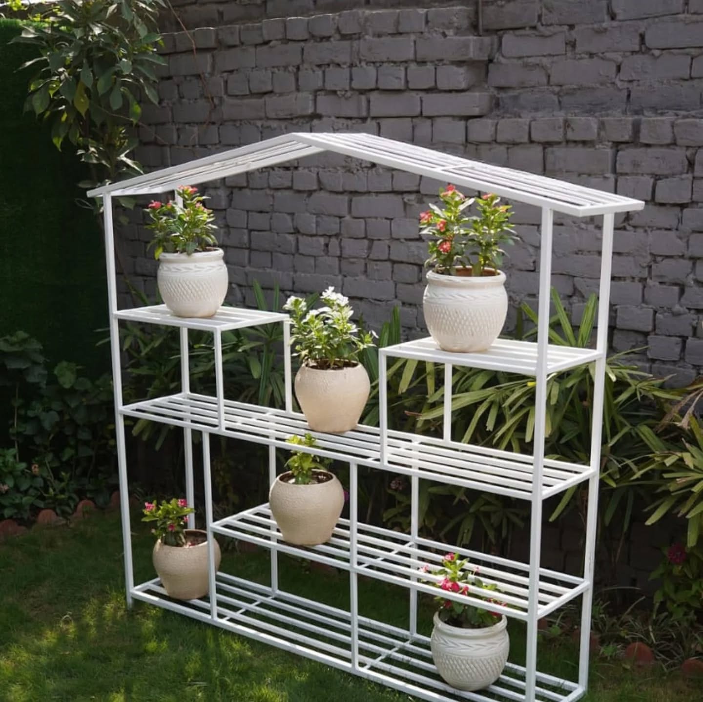 Artisanal pottery planters on wrought iron stand