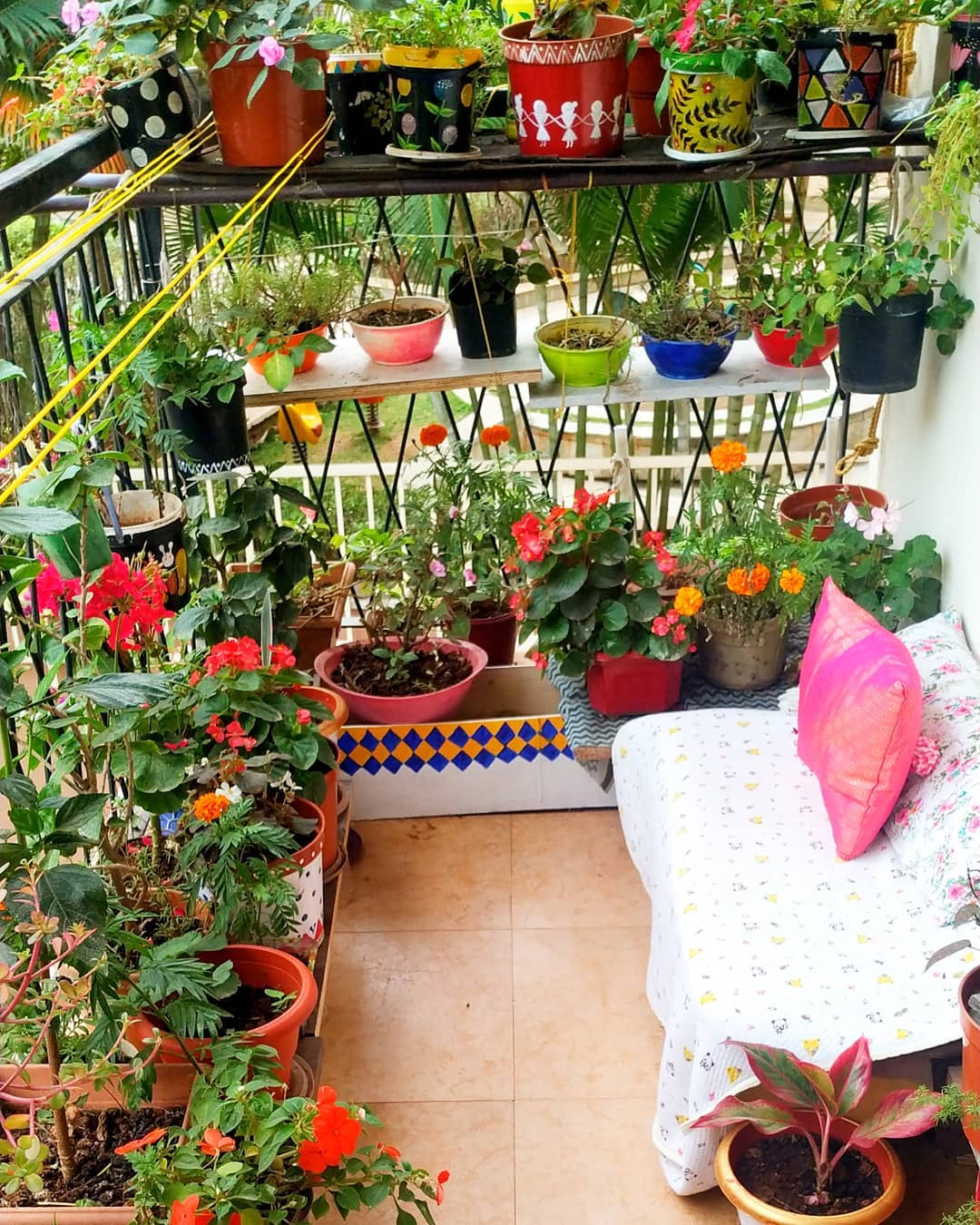 gradient pots on balcony railing