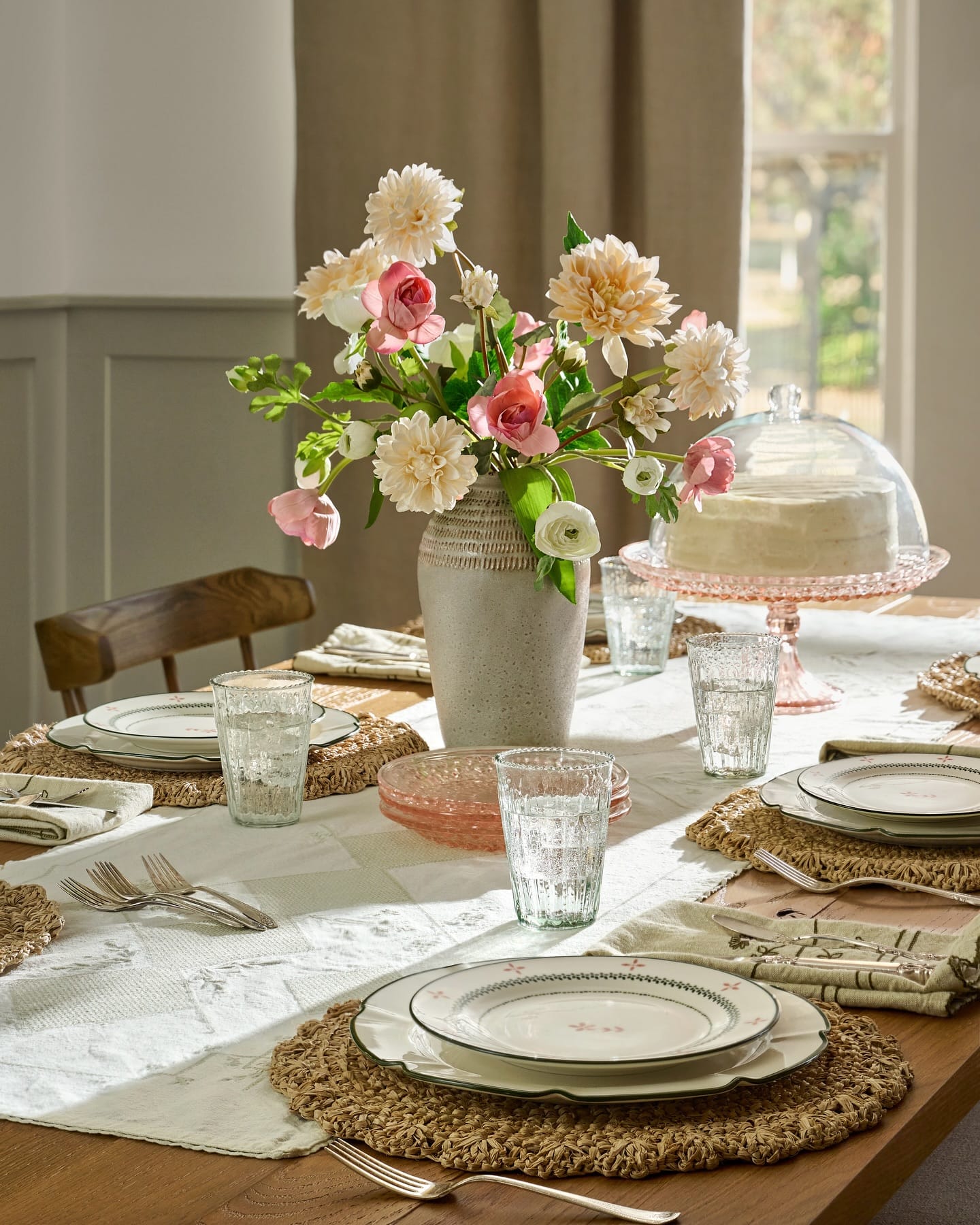 marble-look planter with succulents on dining table