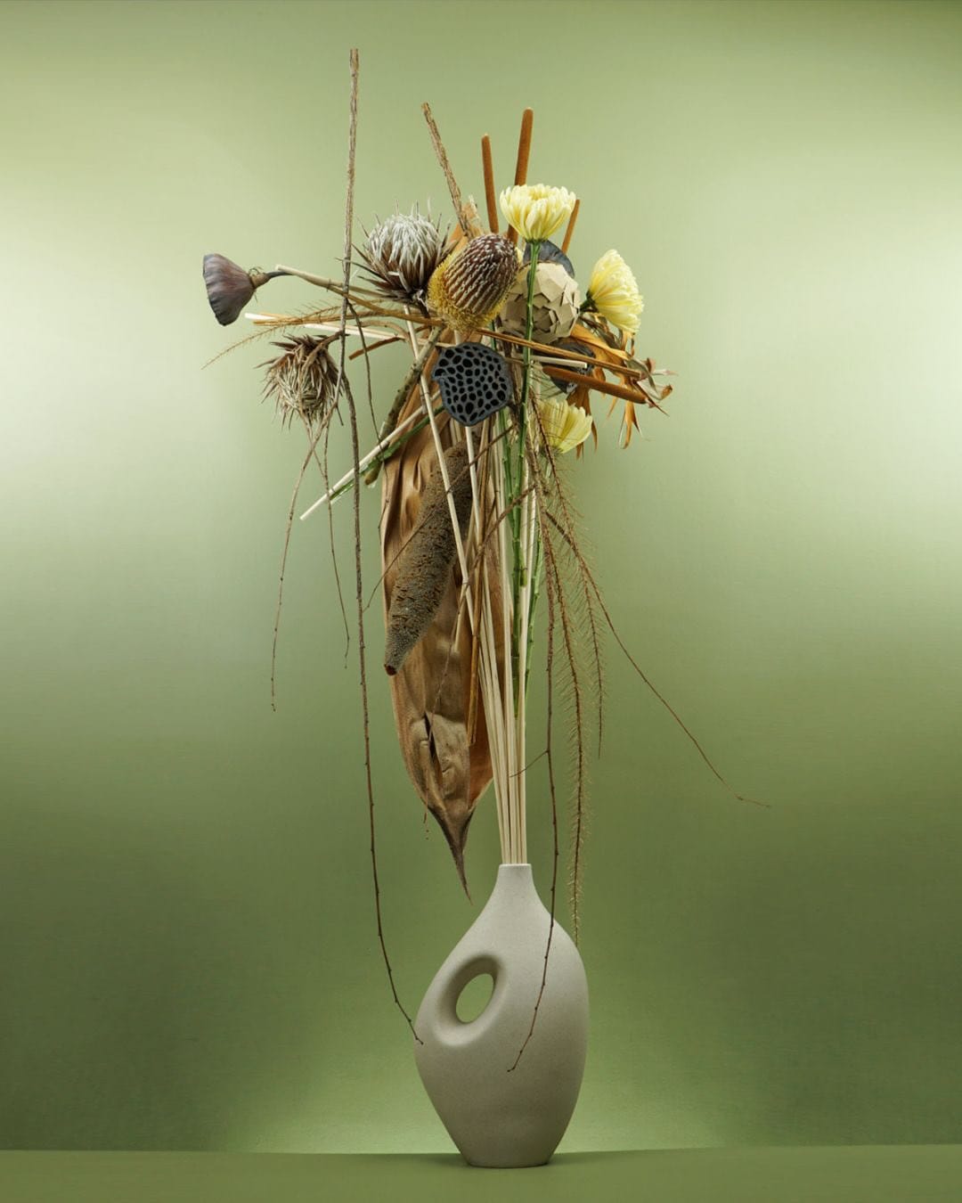asymmetrical wall vase with wildflowers