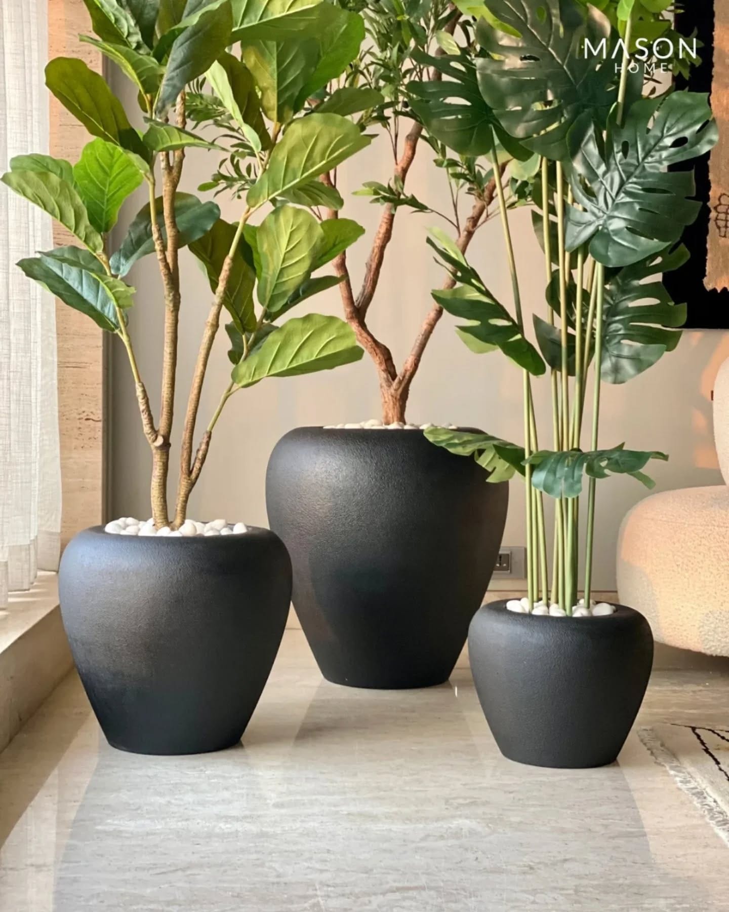 matte black planter on windowsill