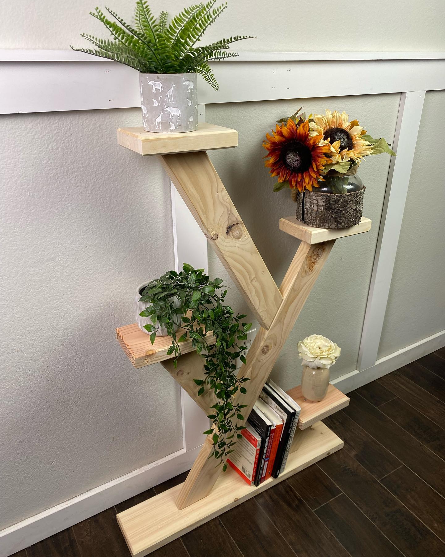 Wooden ladder shelf with potted plants