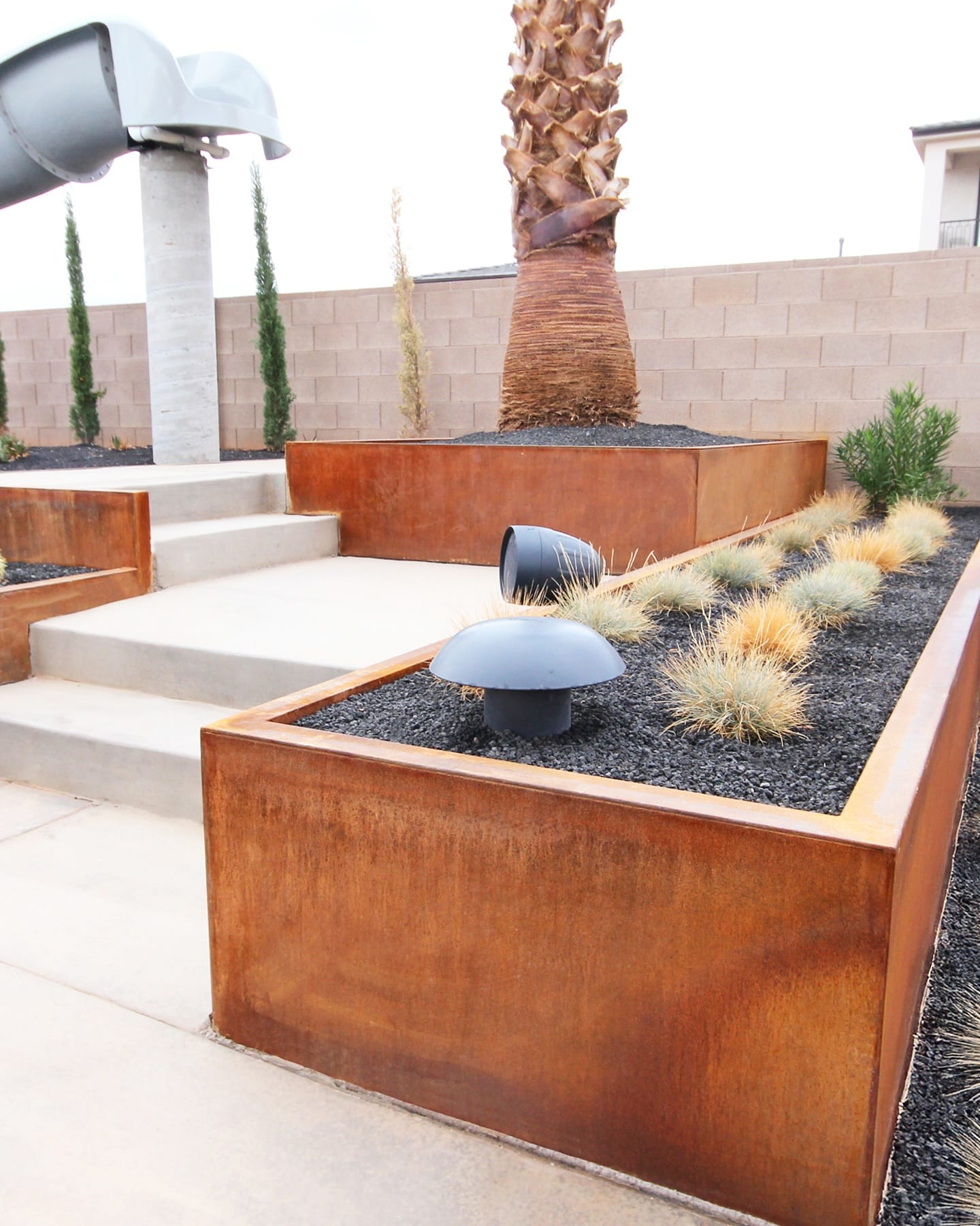concrete and metal planter on city balcony