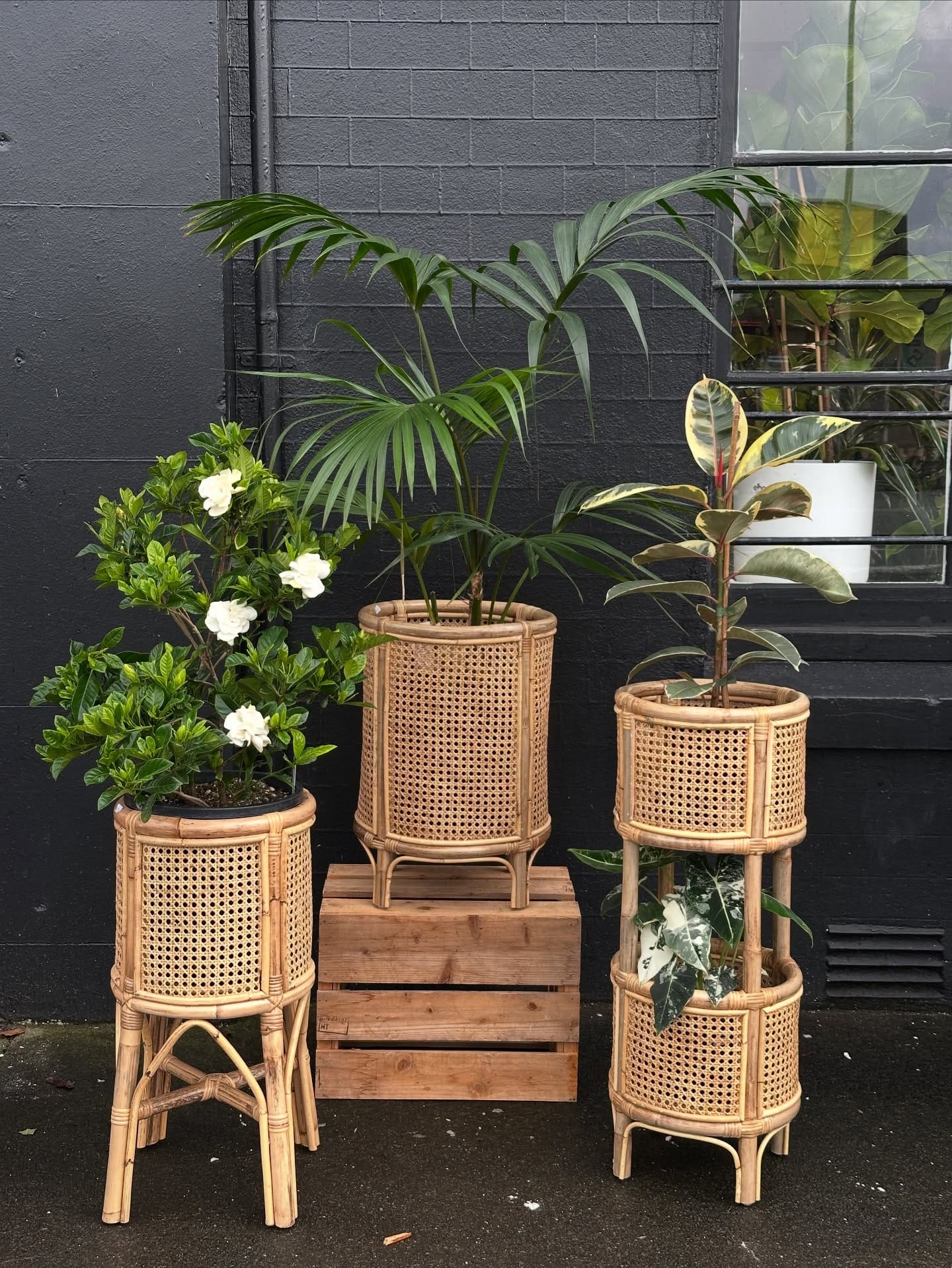 Rattan shelf with rustic decor and wildflowers