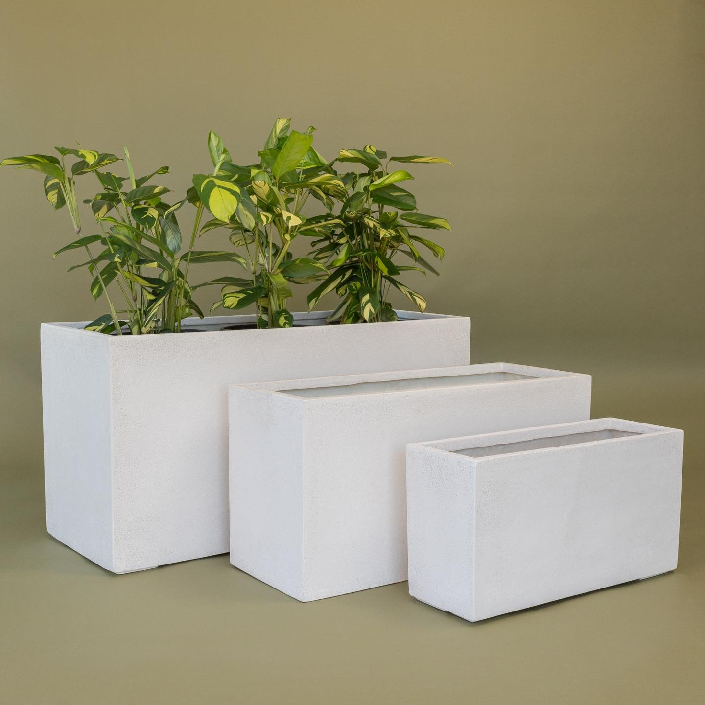 water-resistant fiberglass planter by pond