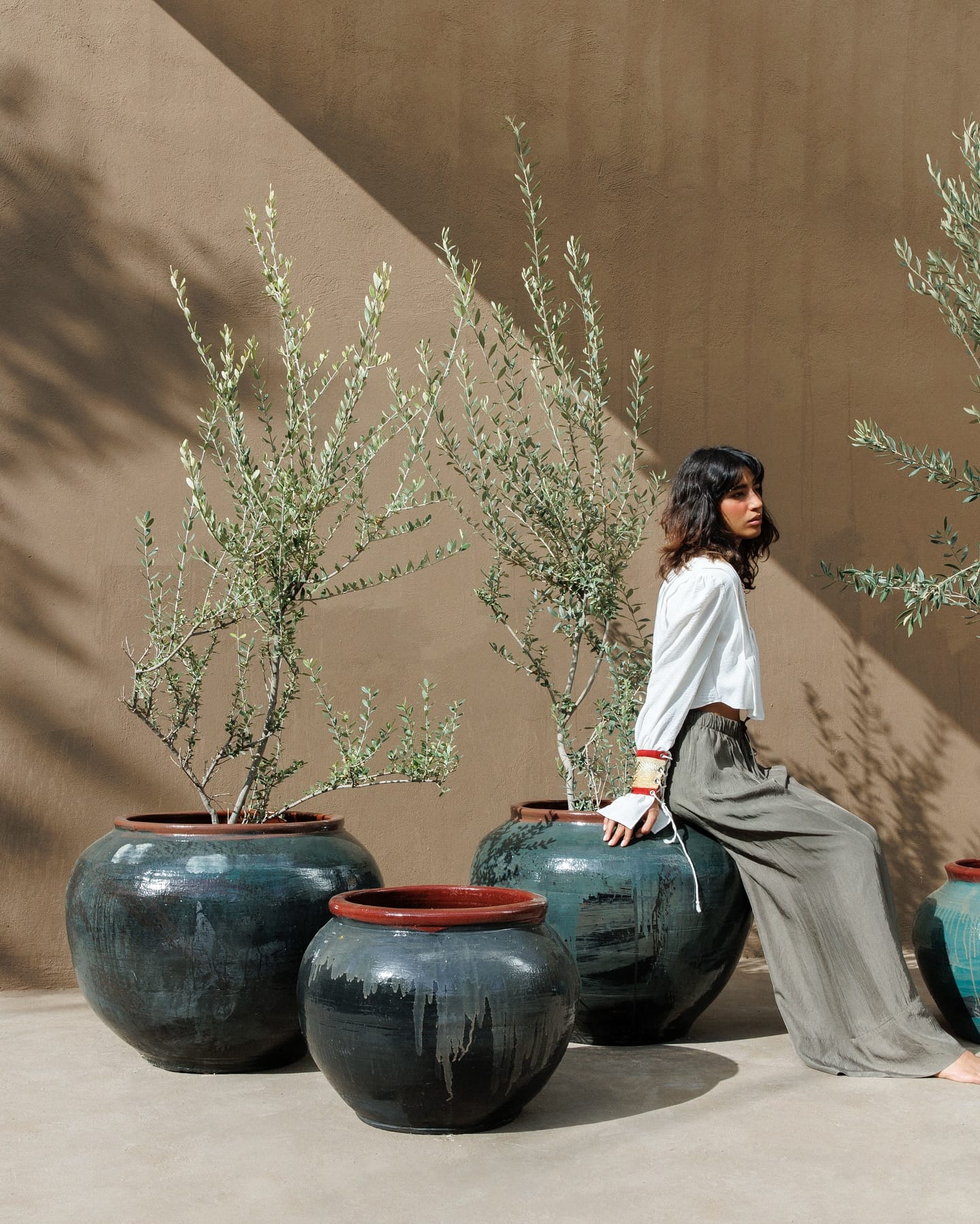textured ceramic pots on shelf