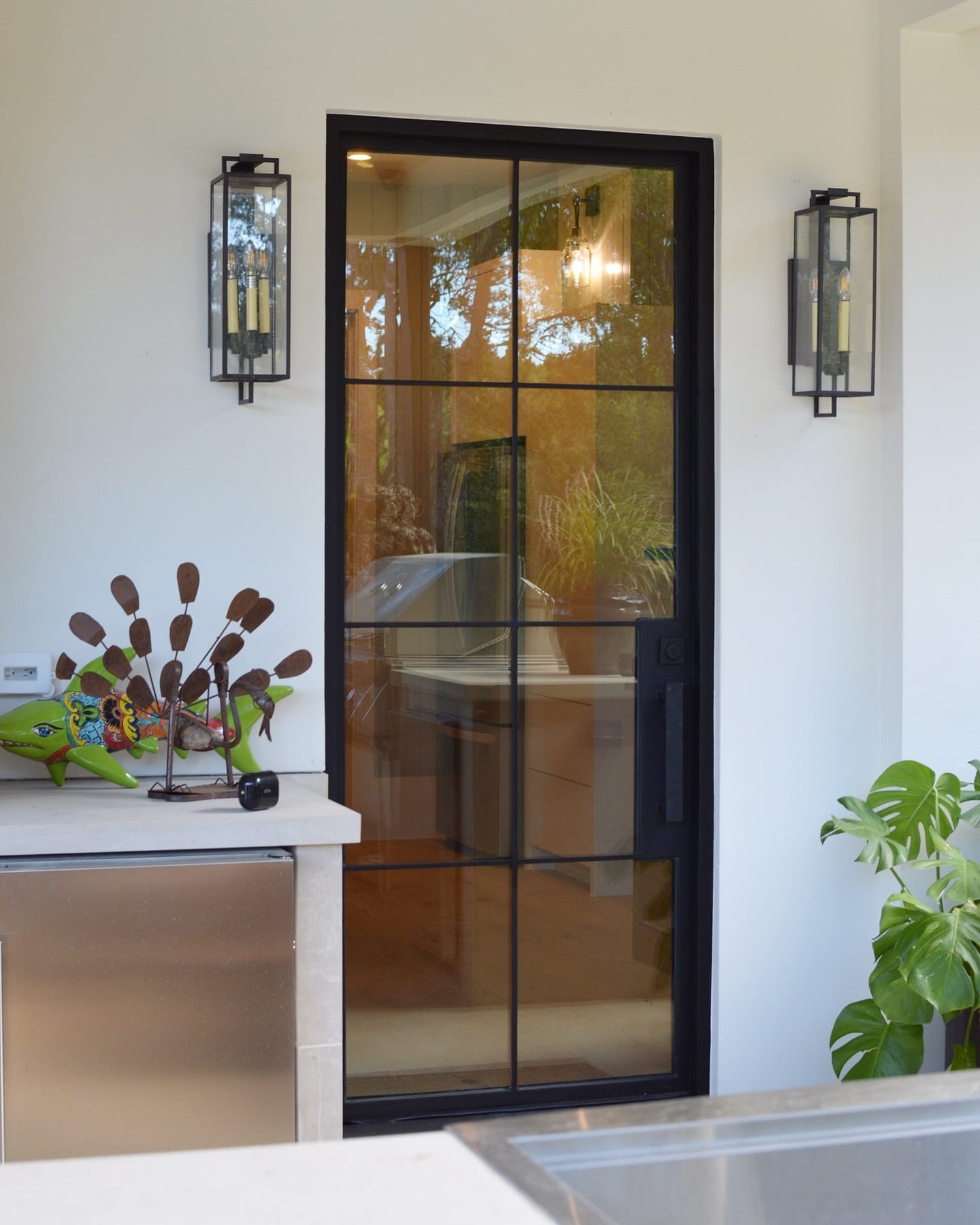 glass doors with plants nearby