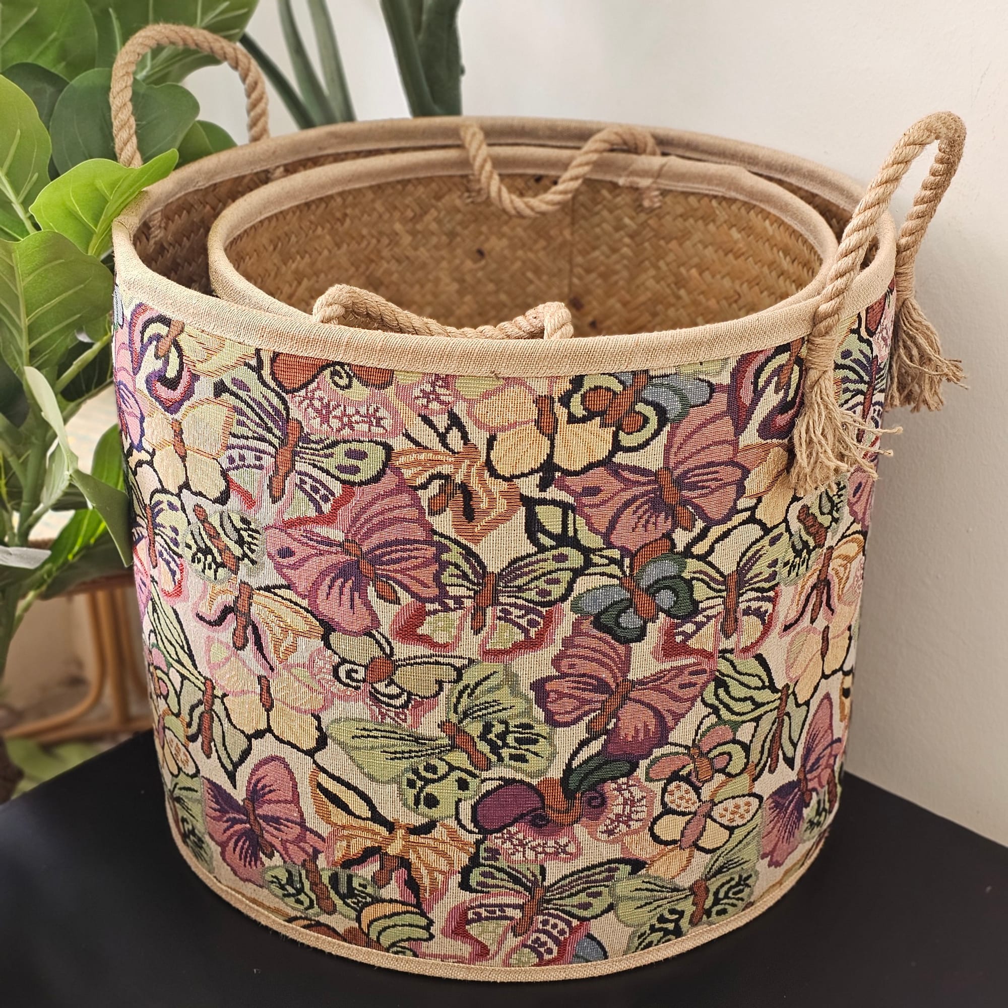 Rattan shelf with art deco accents and lush plants