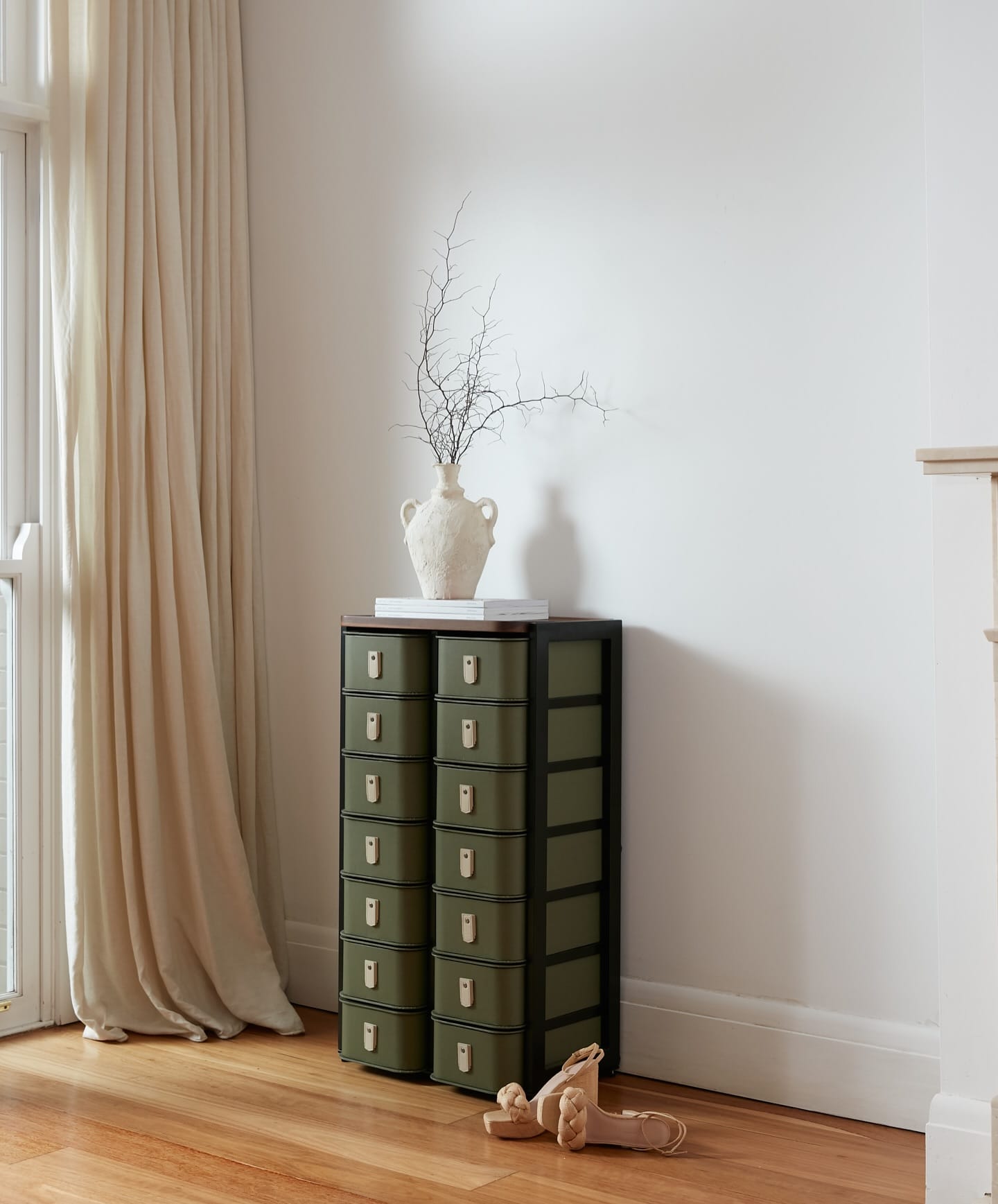 olive green storage bins on shelves
