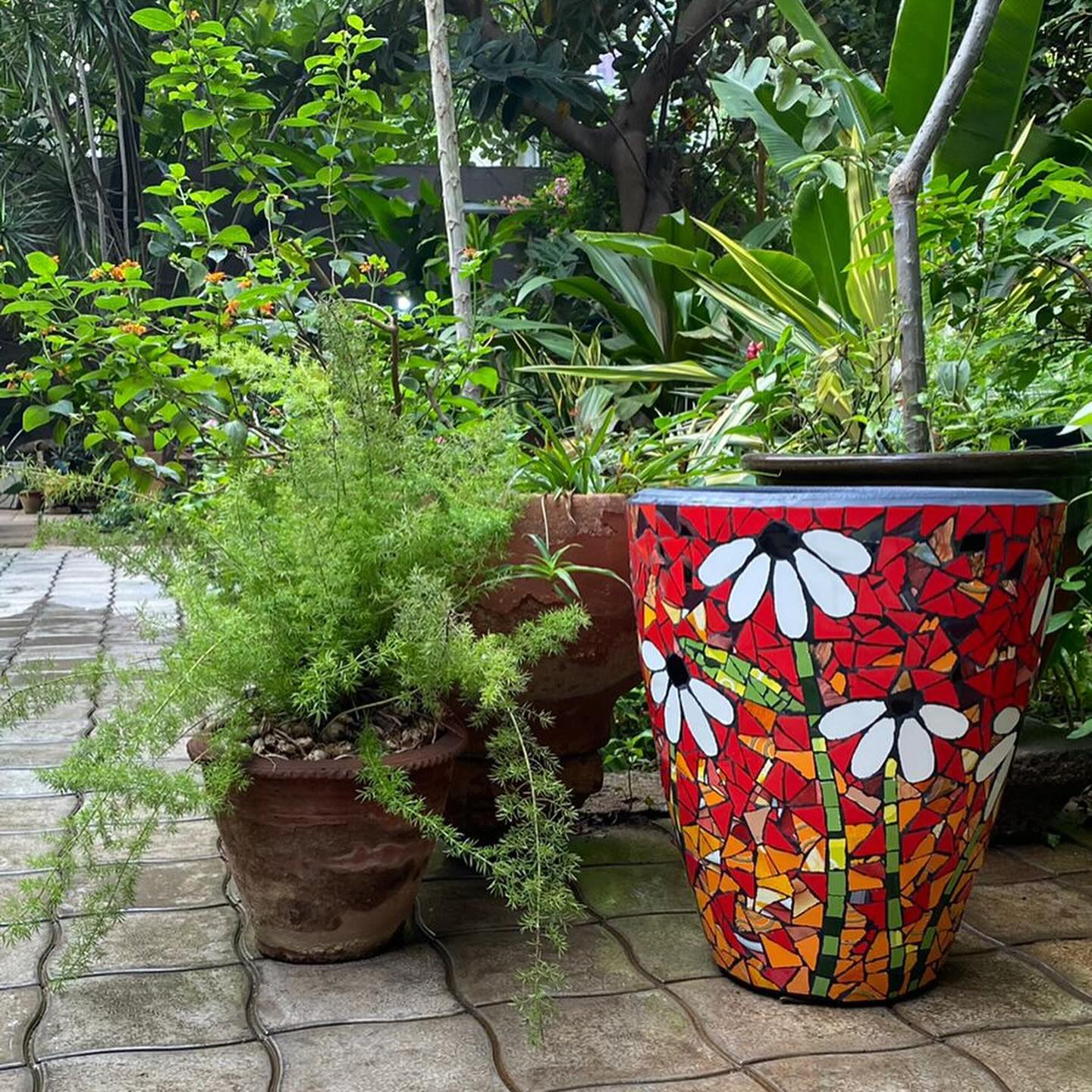 mosaic and stone planter on balcony