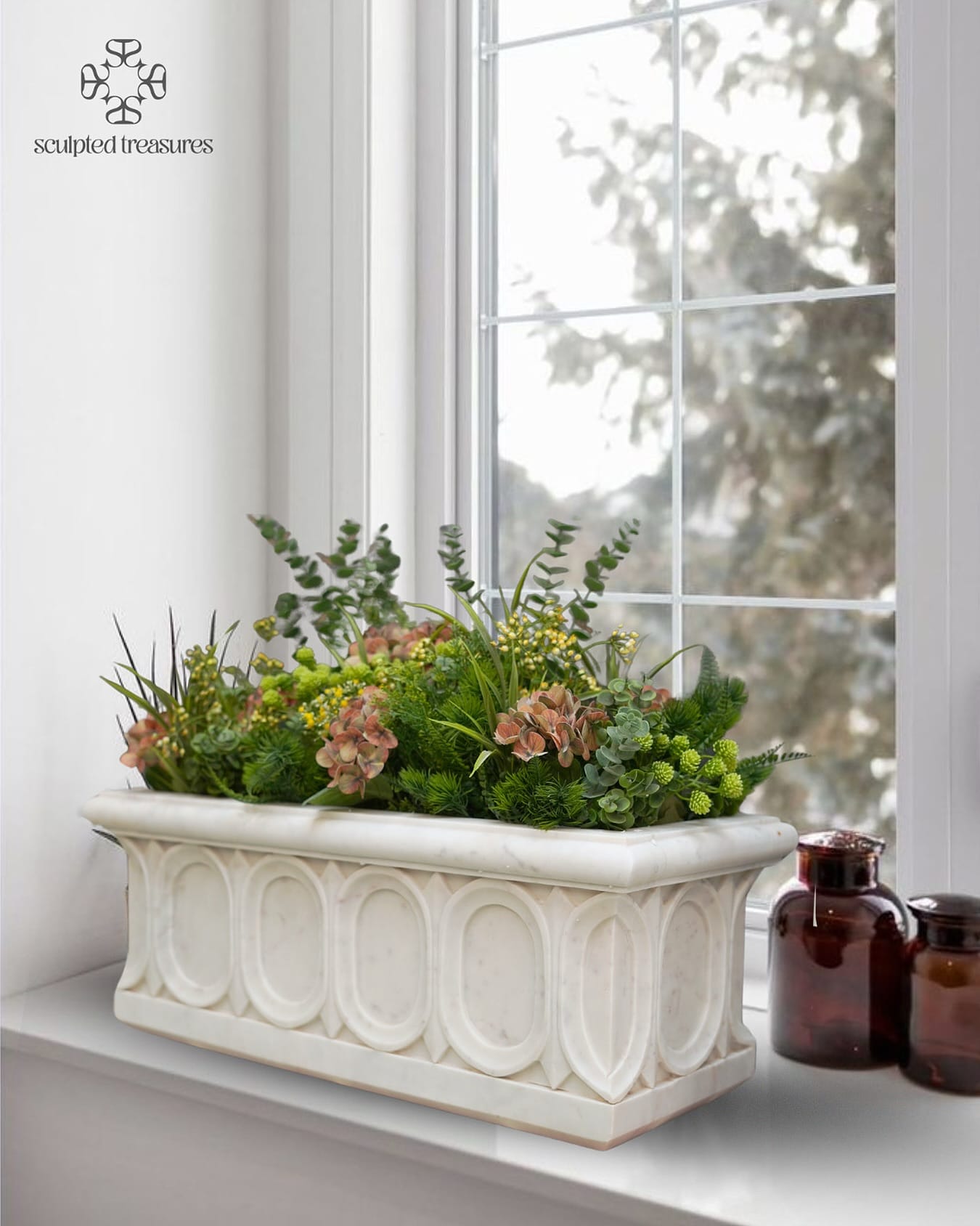 asymmetrical marble-look planter with mixed succulents