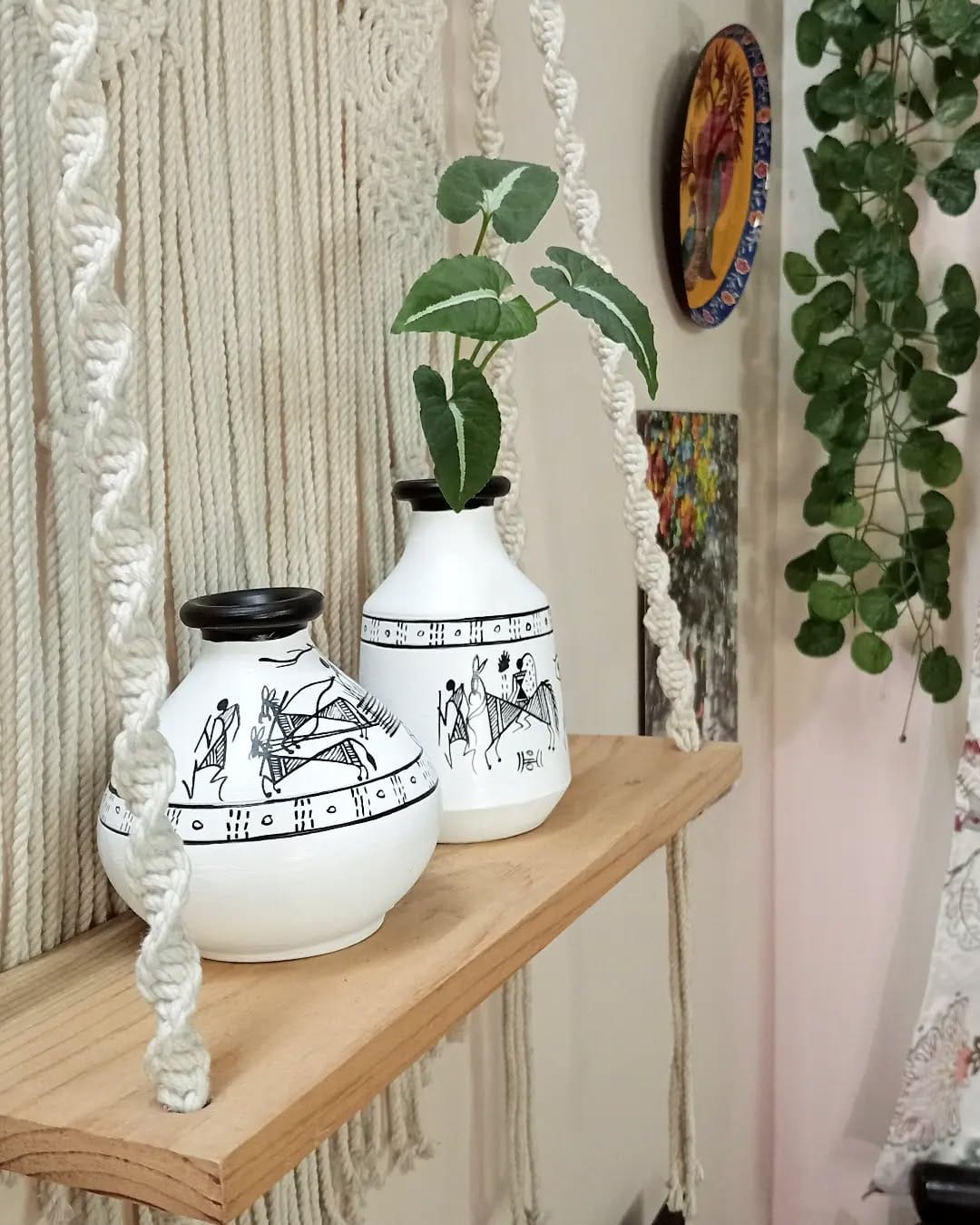 Contemporary white ceramic hanging orbs with plants