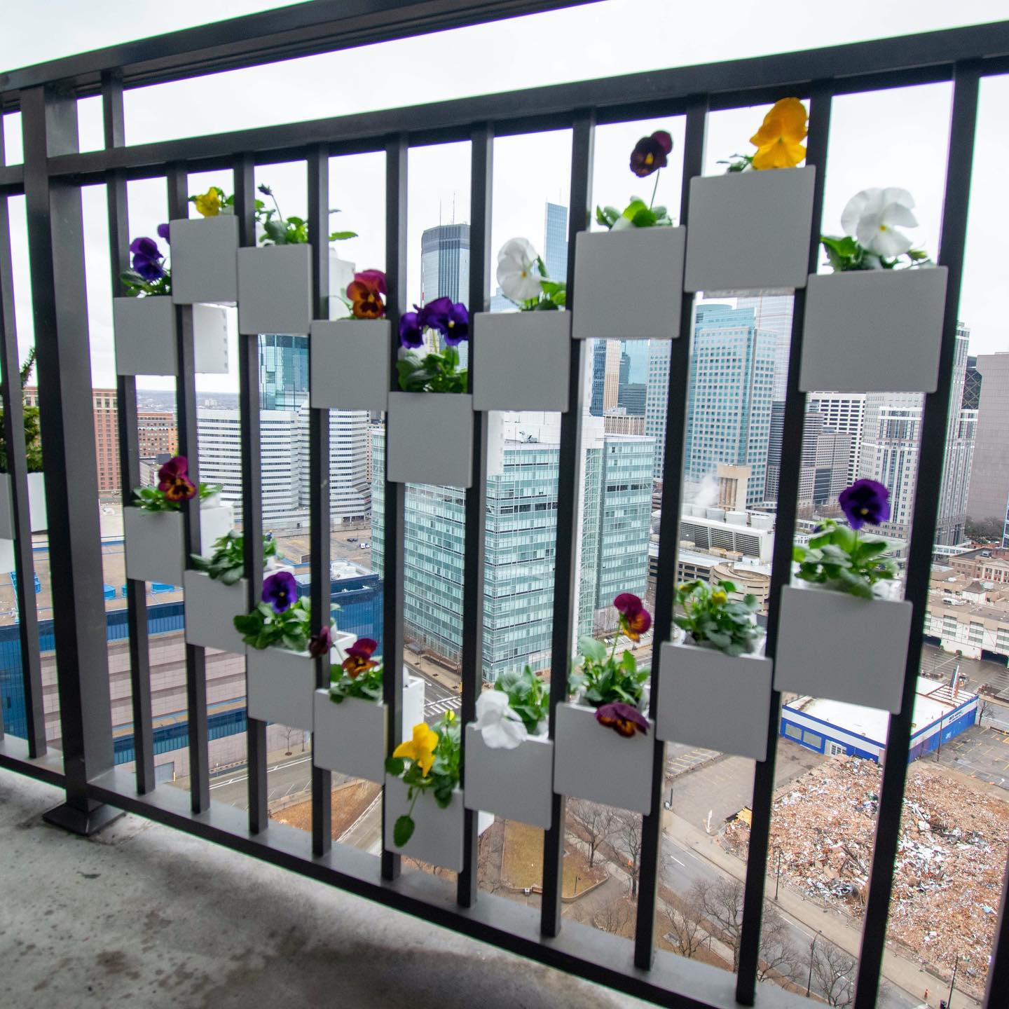 Space-saving balcony rail planter with hidden storage