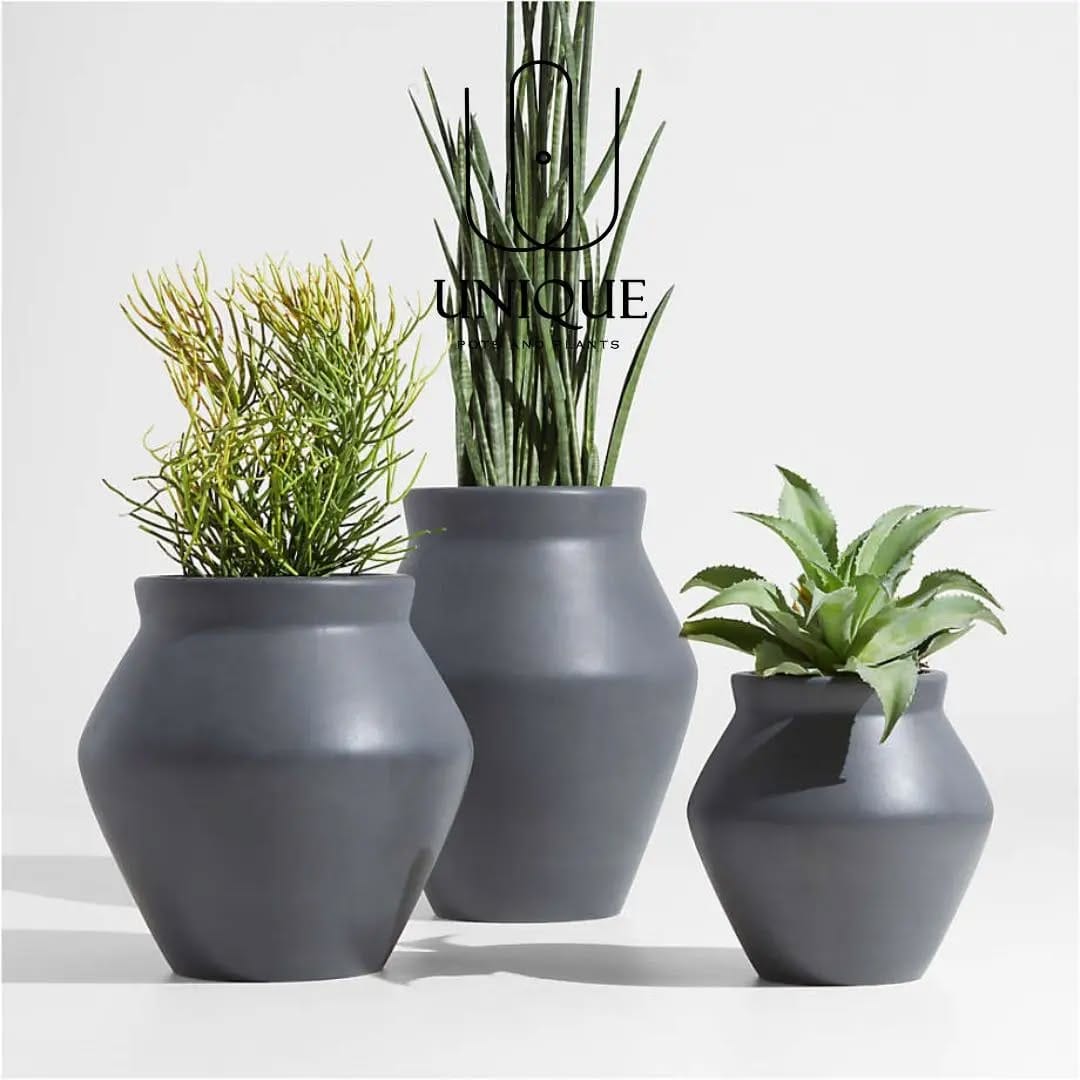 metallic planters on white shelf