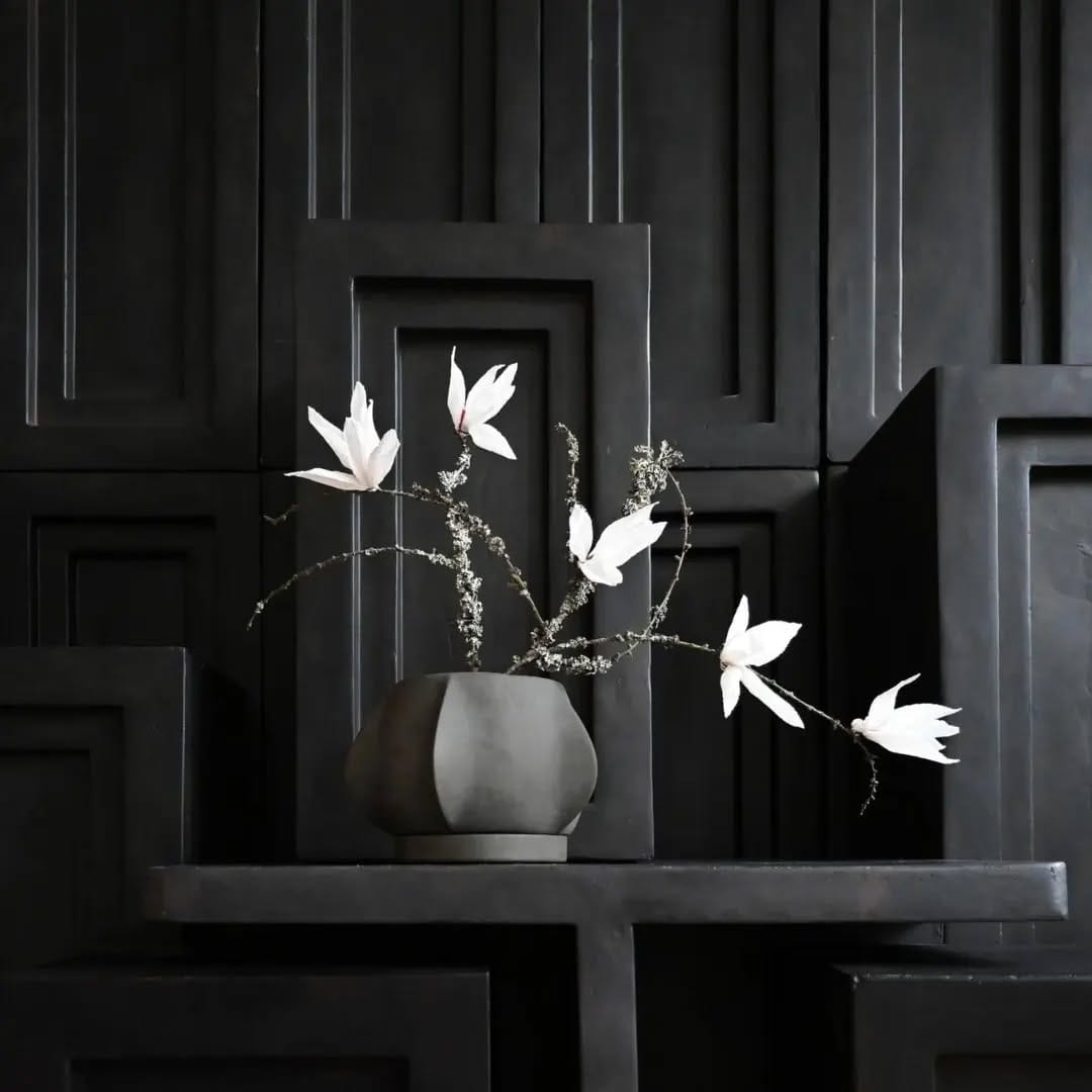 white pots with geometric patterns