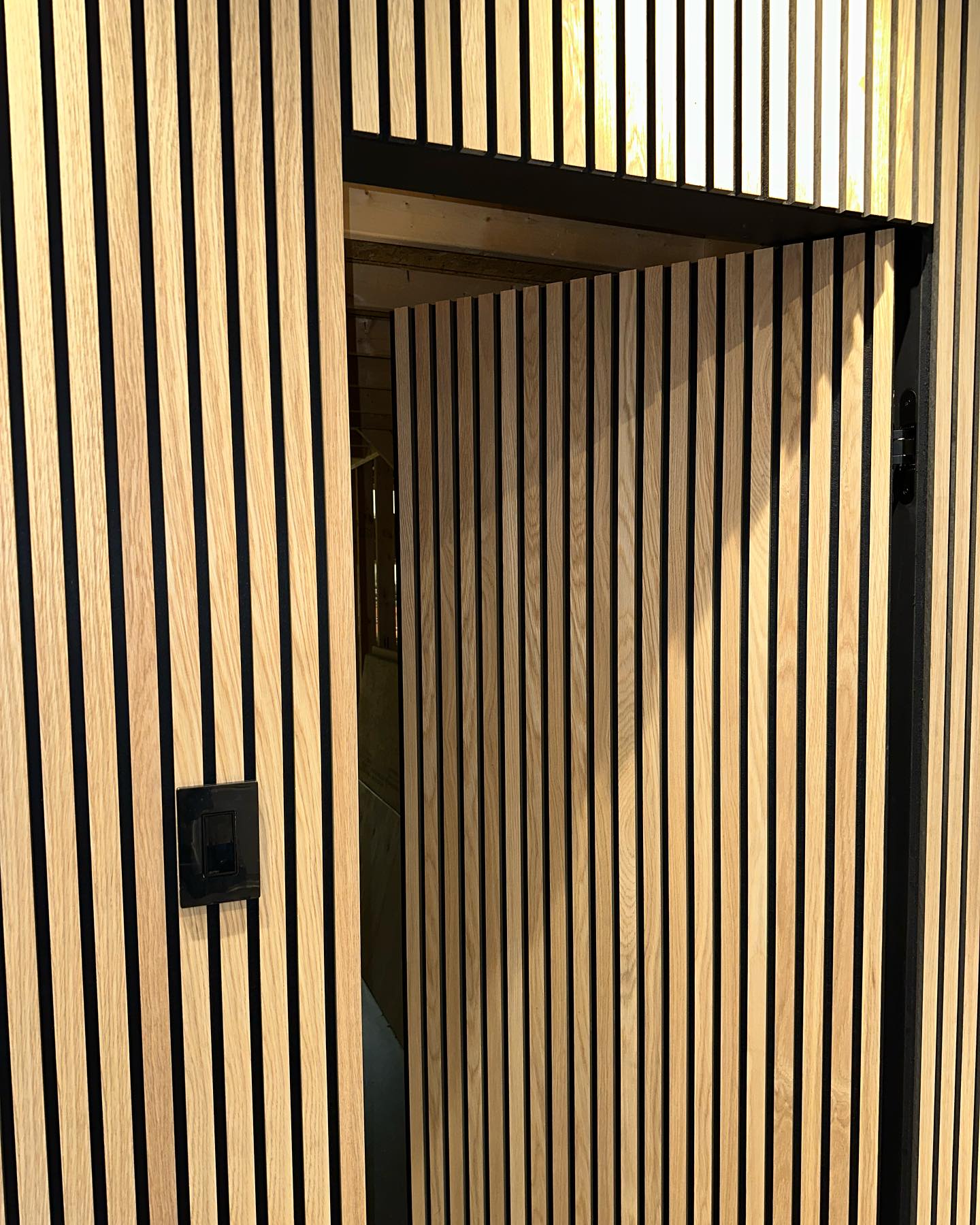 wooden slats casting linear shadows